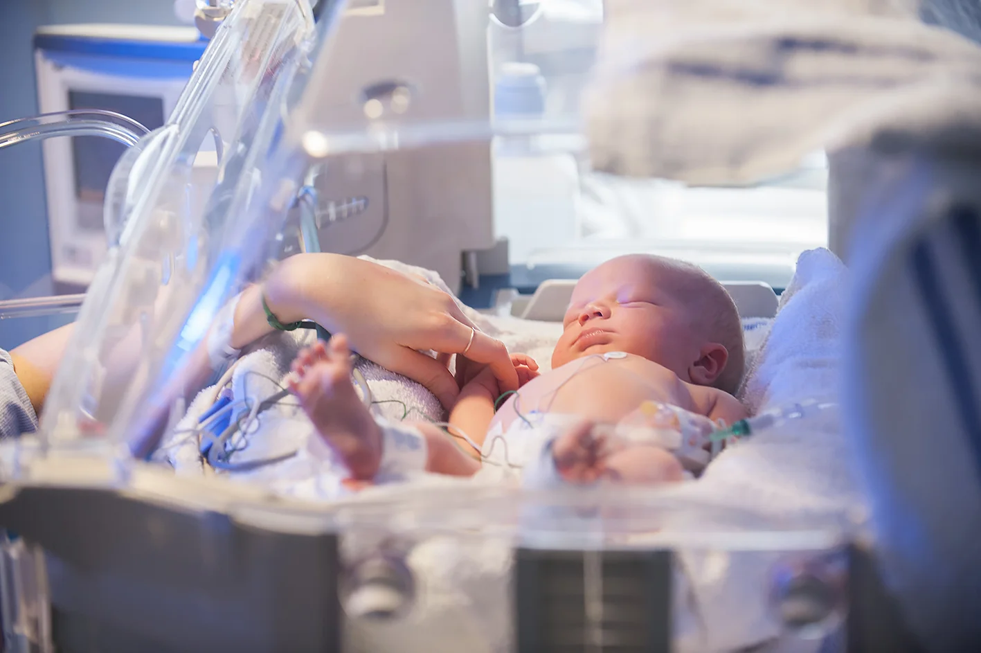 A Portrait of a newborn baby in a incubator in a hospital in London