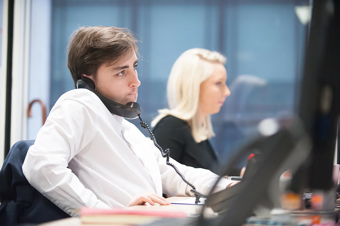 Reportage Portrait of a man on the phone in an office
