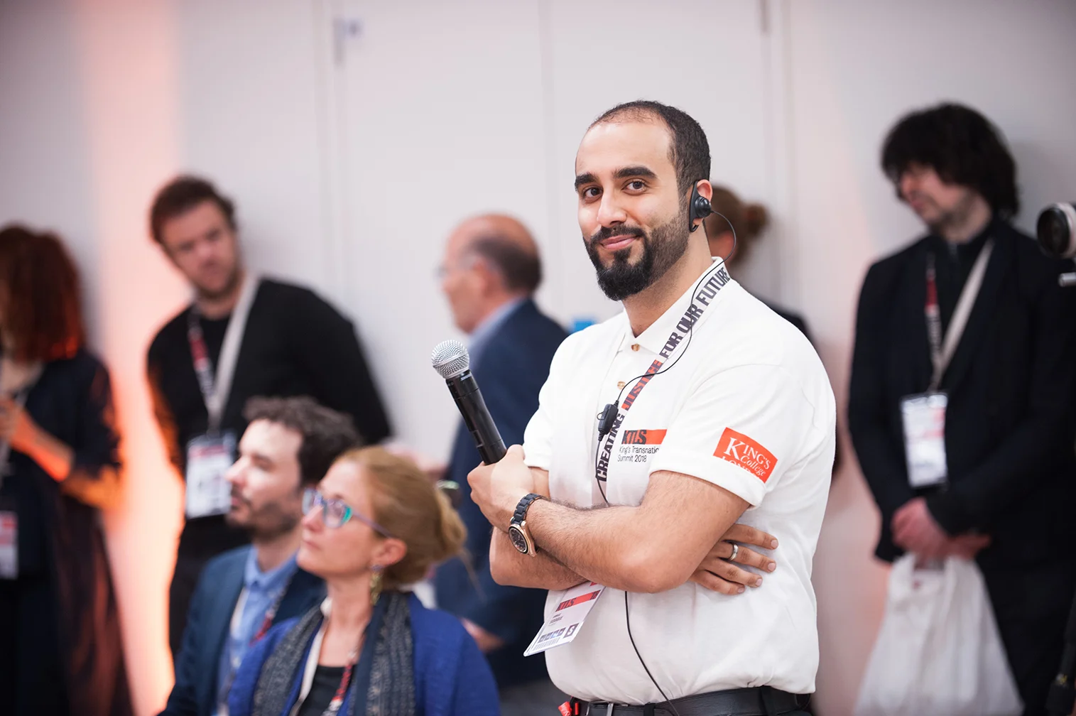 Portrait of a man with a beard working at an event for Kings College London