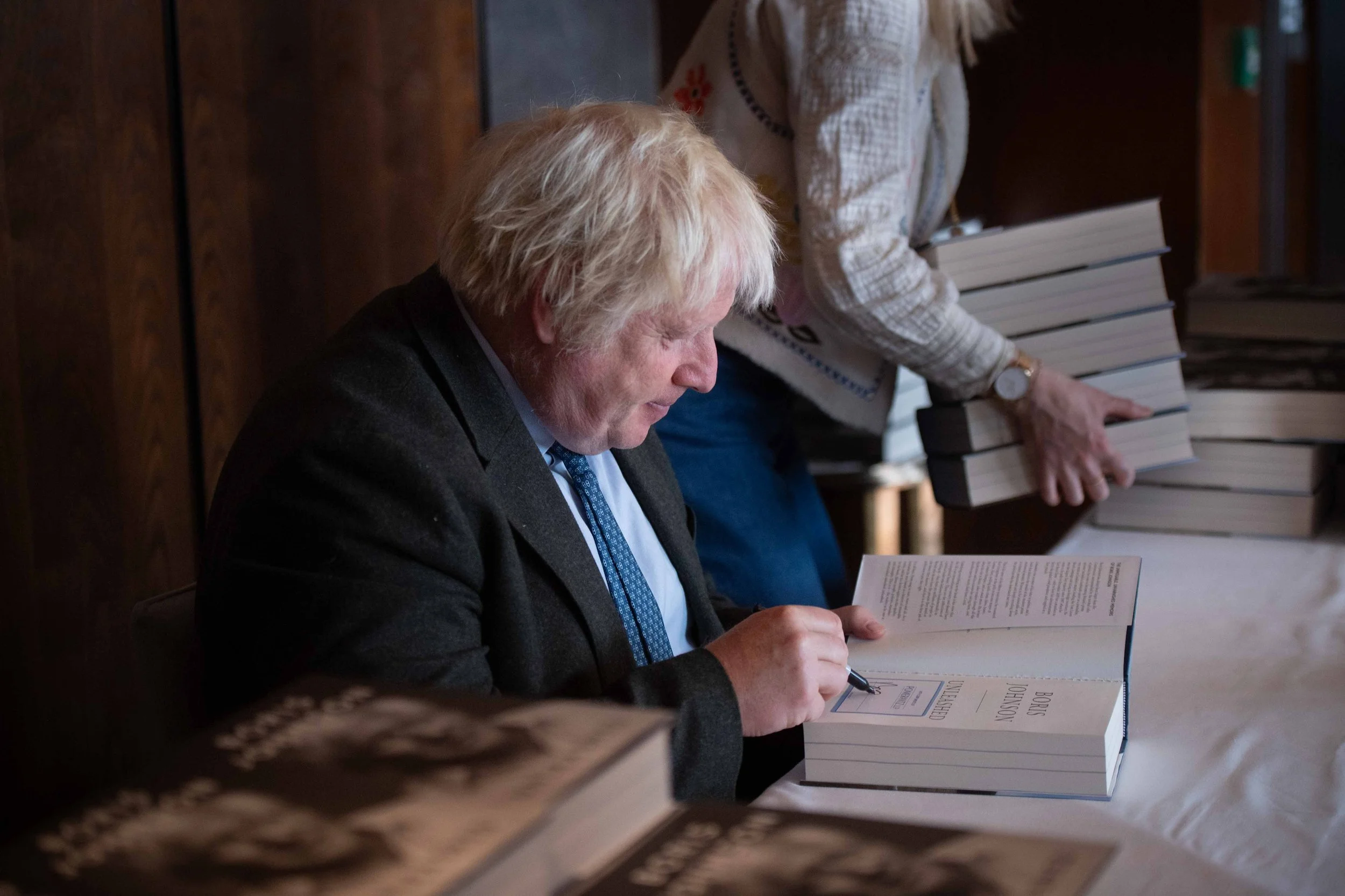Former UK Prime Minister Boris Johnson signing his book at The Shard, London