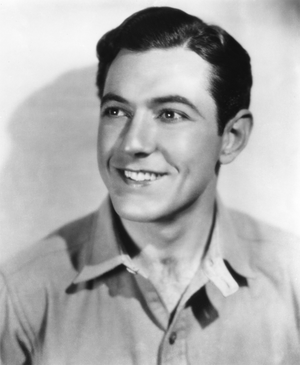 A photo of silver screen idol & the face of Wheaties cereal boxes Johnny Mack Brown is pinned to the wall in character Jud's room