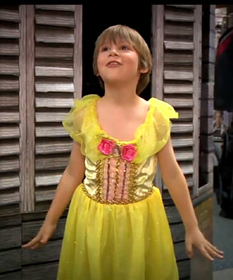 "The Belle dress is a bright shimmery yellow and in the soft light it looks like gold... It would be impossible to be sad in that dress."