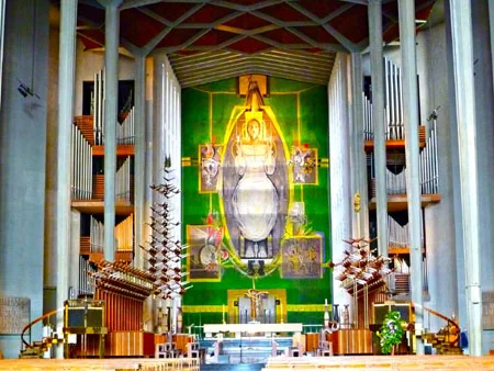 Coventry Cathedral tapestry: "His tapestry Christ in Glory, stood the full height of the building, its solid colours and softness a counterpoint to the brilliance of stained glass, gazing down the length of the nave at the ruins behind."
