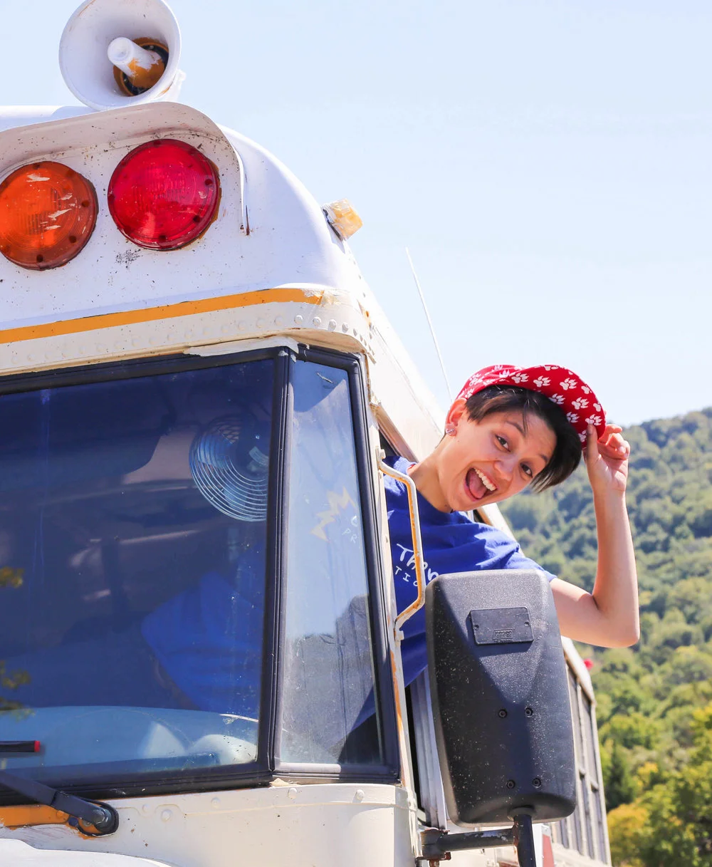 erin leaning out of the bus.jpg