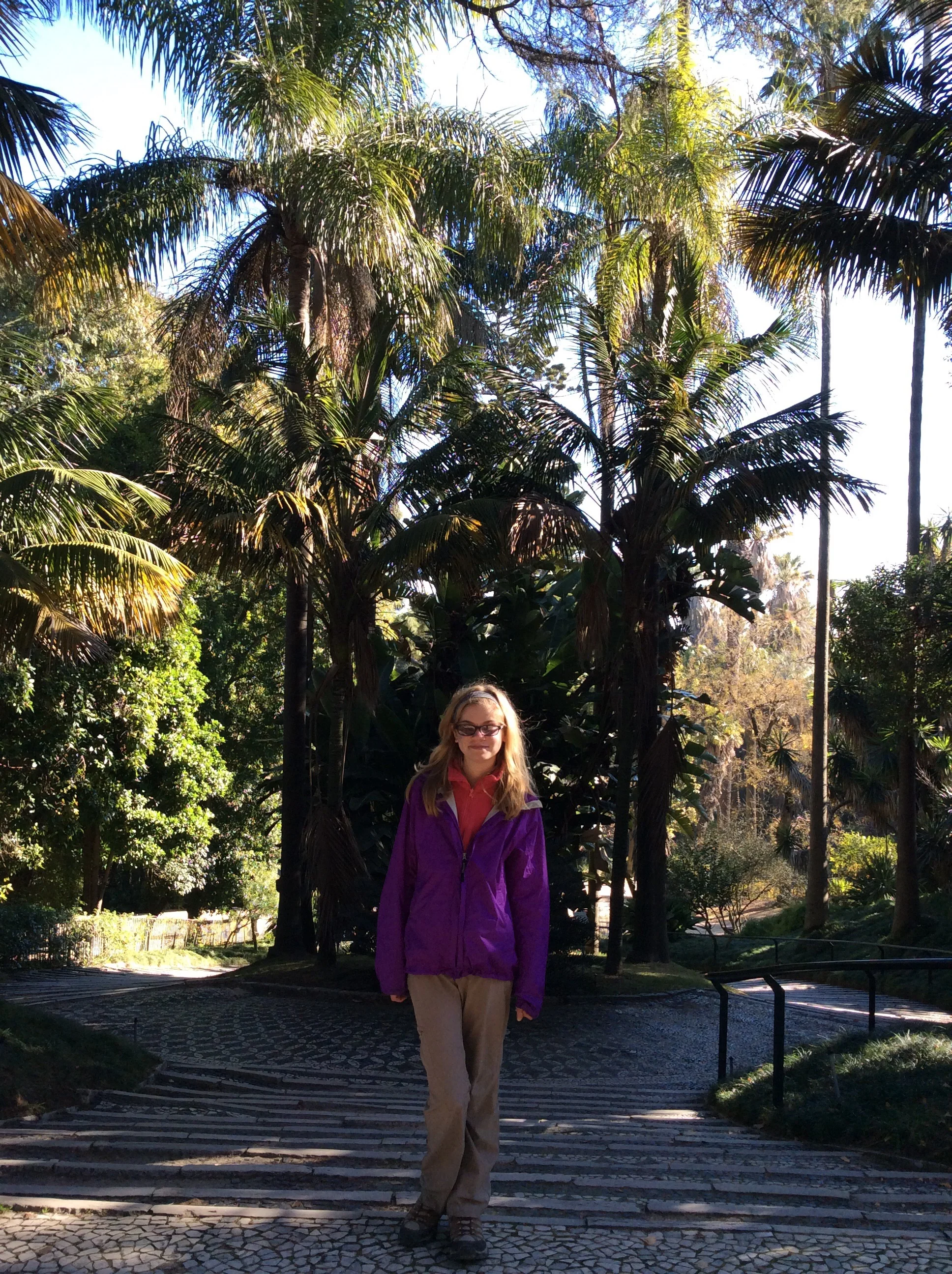 Maeve posing near the entrance of the gardens.