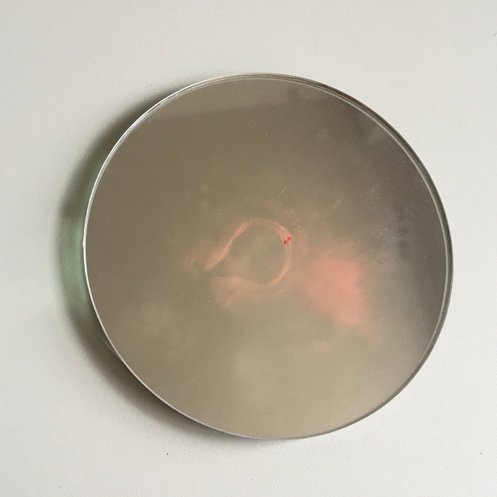 small round mirror on white background