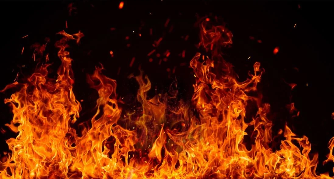 Wallpaper featuring dancing flame patterns against a black background.JPG