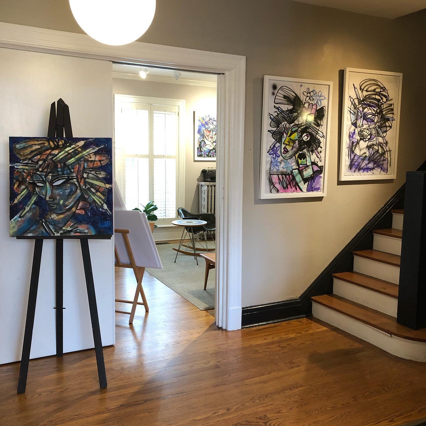 Paintings on the stairwell ... love this look and especially if you go with a large scale work to get a big impact ... these works on paper from our current Bipolar Holiday: Kyoto Girls exhibit stand out with good lighting and the white frames are a 