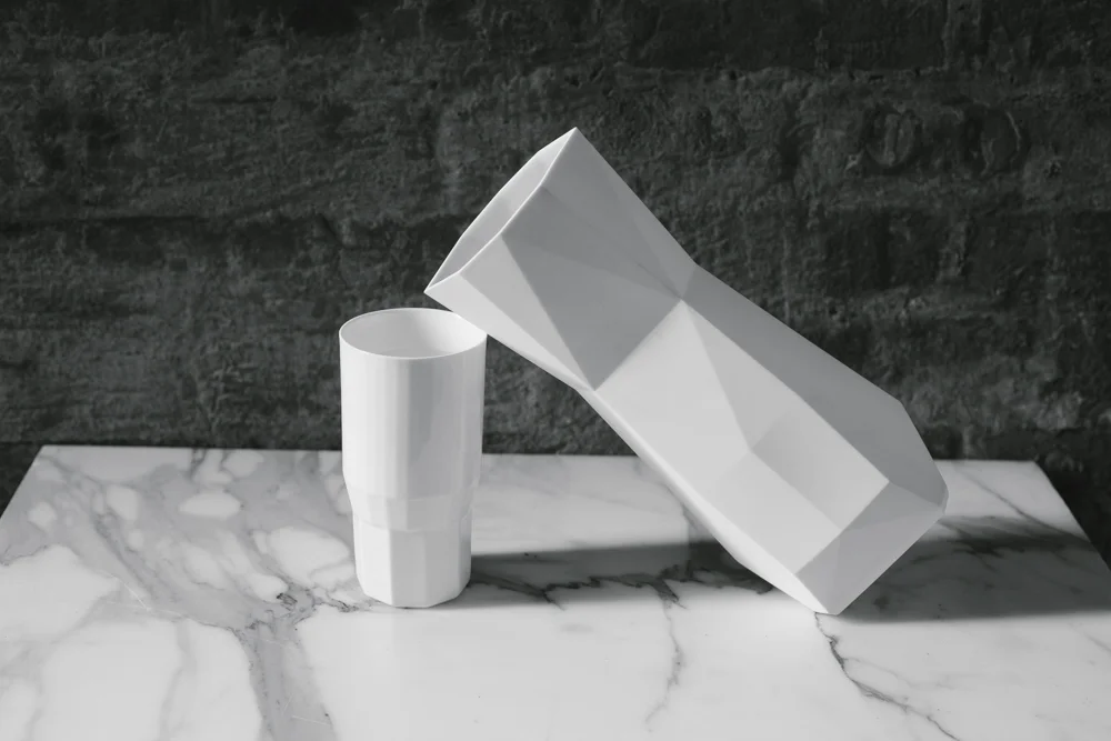 Styled set with 1882 Small Cup and Pitcher in Bone China balanced on each other