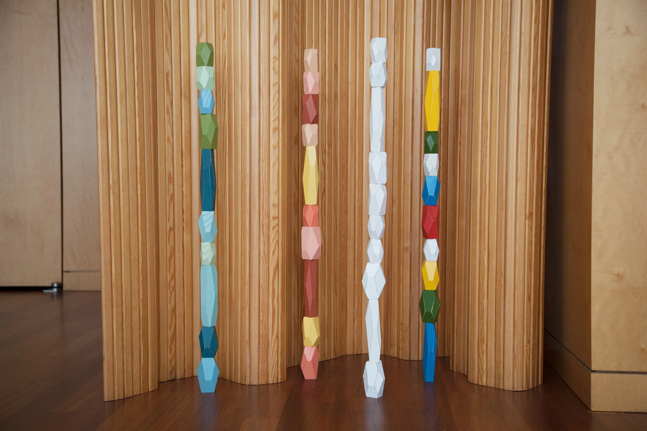 Multi, Ocean, Desert and White Balancing Blocks Assembled Tall with Wooden Wall Background