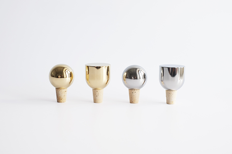Collection view of all Mass Wine Stoppers in Brass and Stainless Steel
