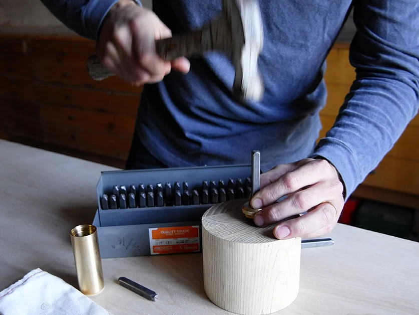 In process photo of custom stamping of Fire Kit