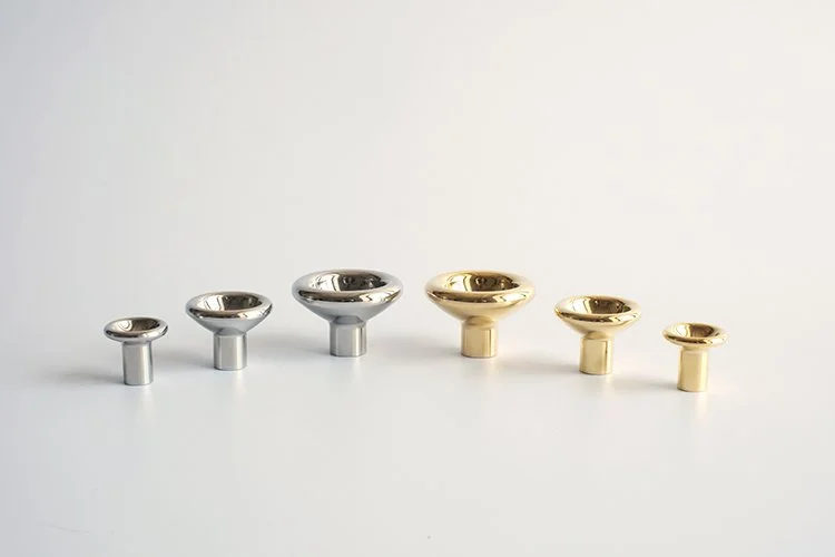 Concave Knobs in Both Polished Brass and Stainless Steel in Three Sizes Each: Large, Medium, Small