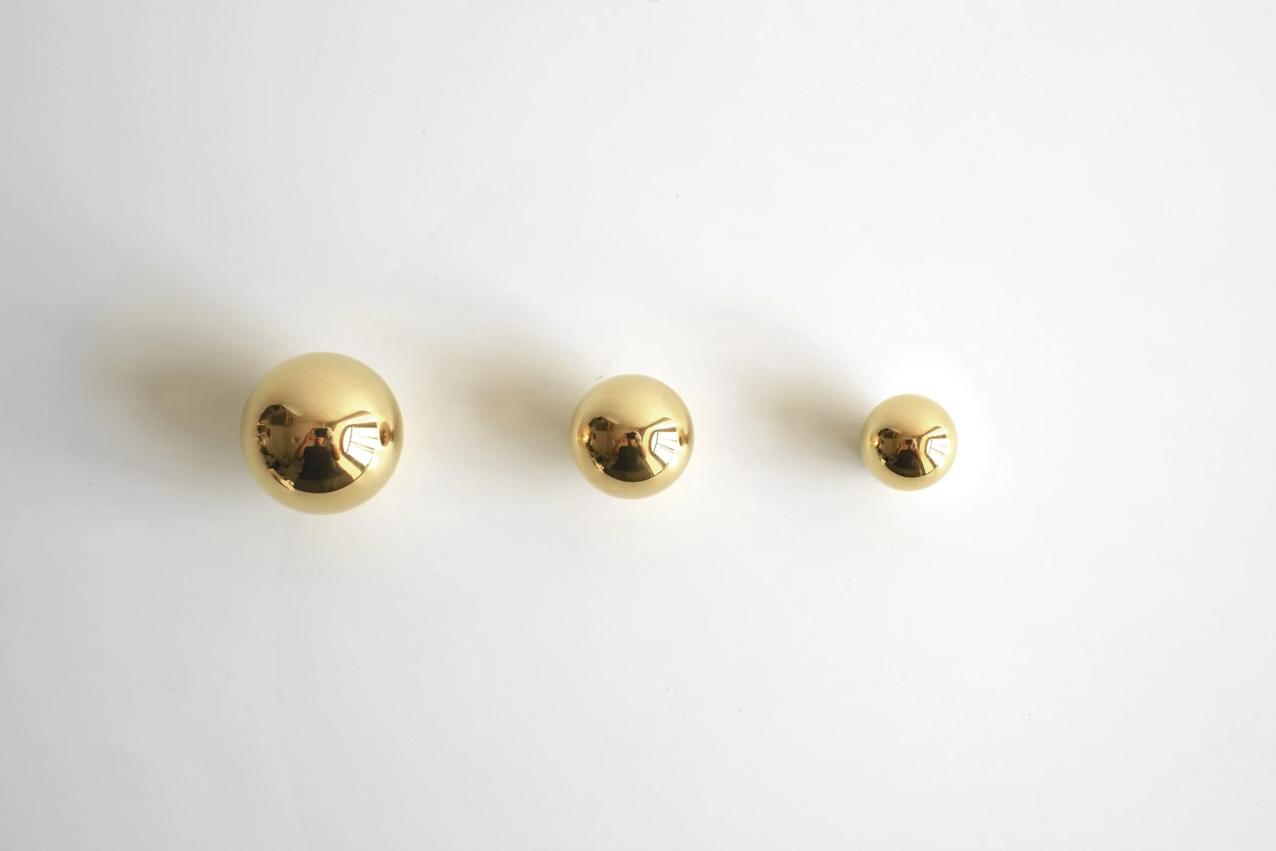Three Polished Brass Sphere Knobs in sizes: Large, Medium, Small