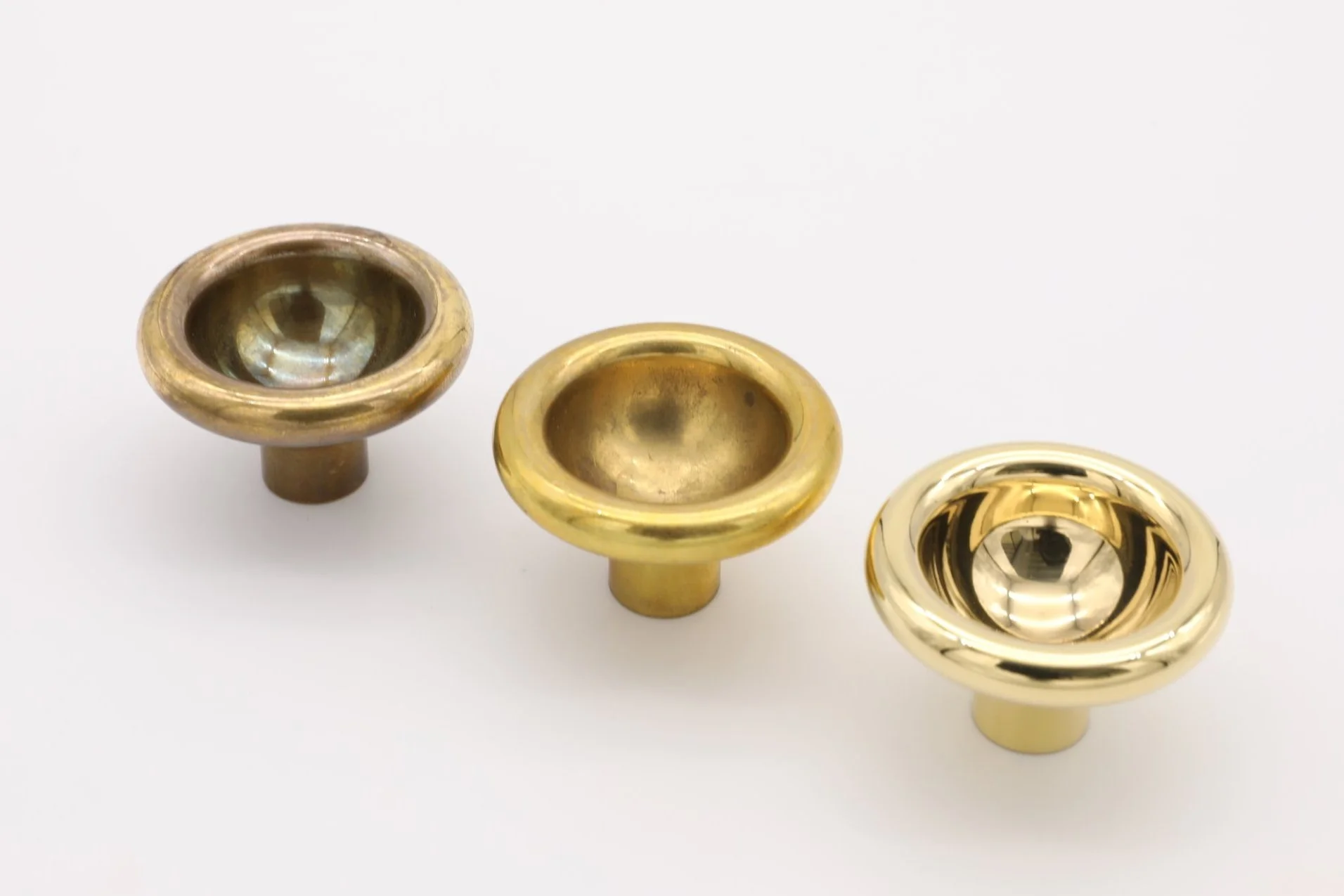 Image showing stages of polished brass patina from high polish to slight patina and deep patina
