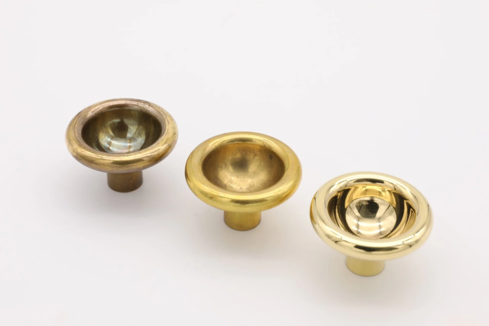 Image shows three stages of patina on brass: highly polished, light patina, deep patina