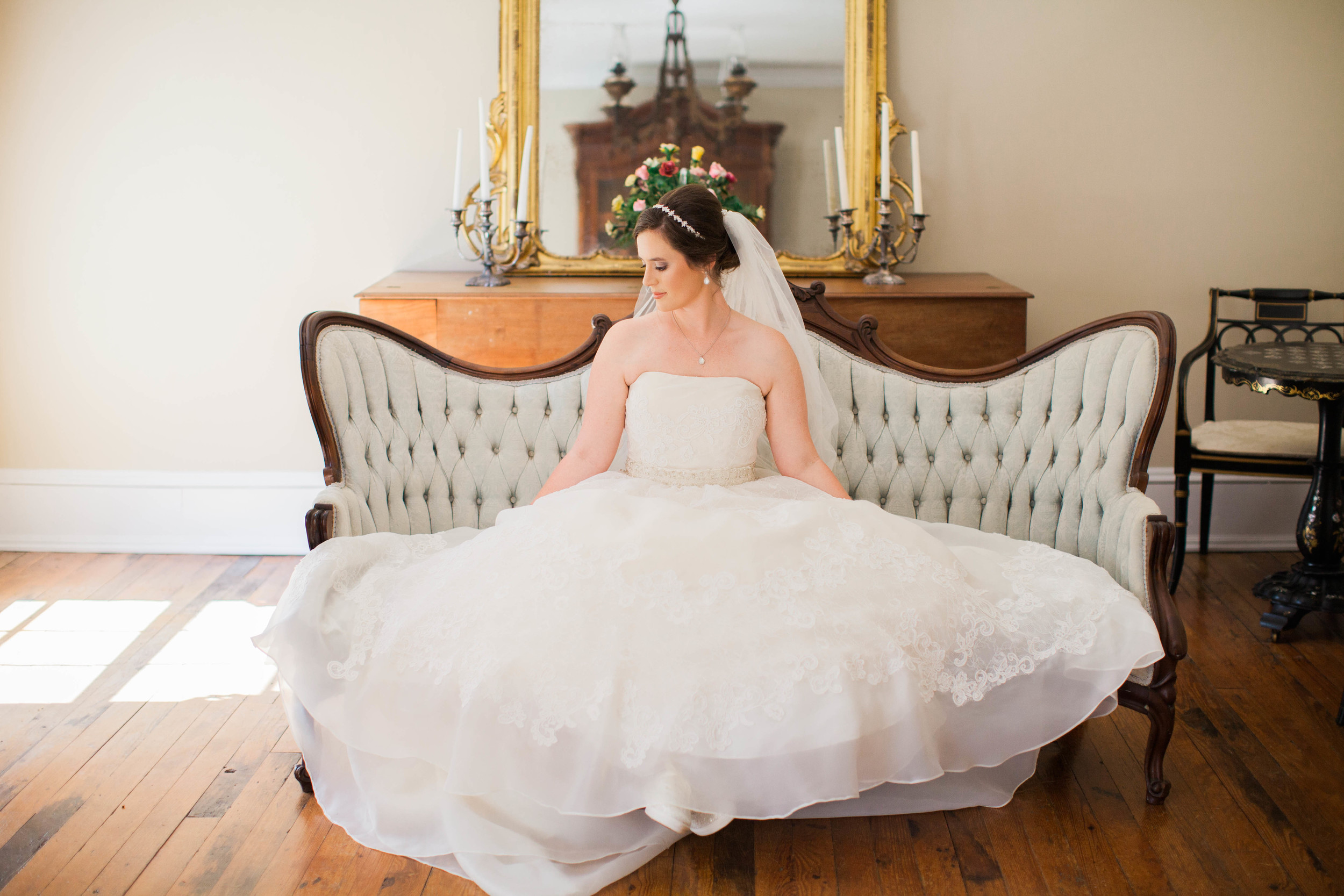 Beautiful bride sitting in wedding gown at Cokesbury College