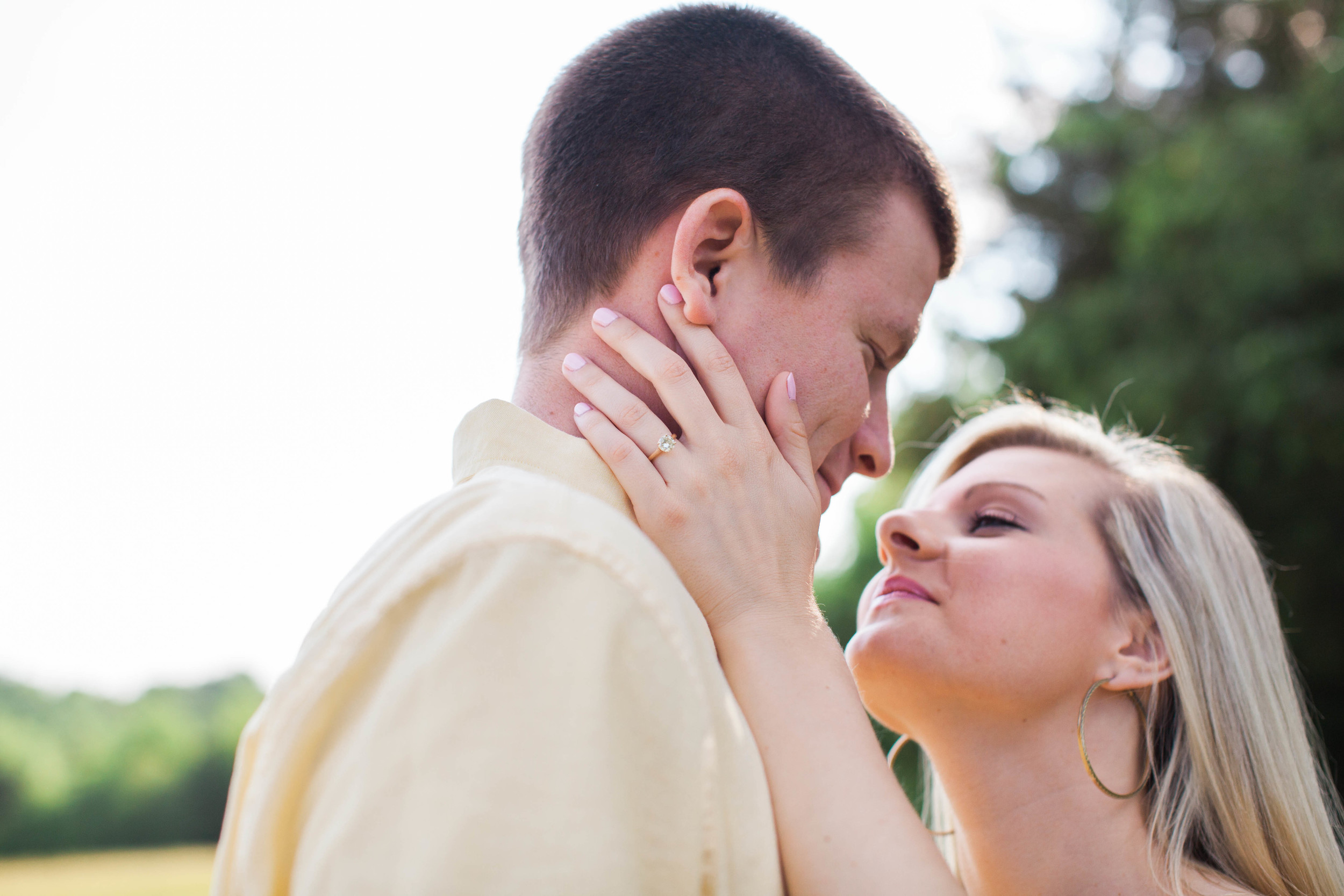 Couple in love at their engagement session at Ellery Farms