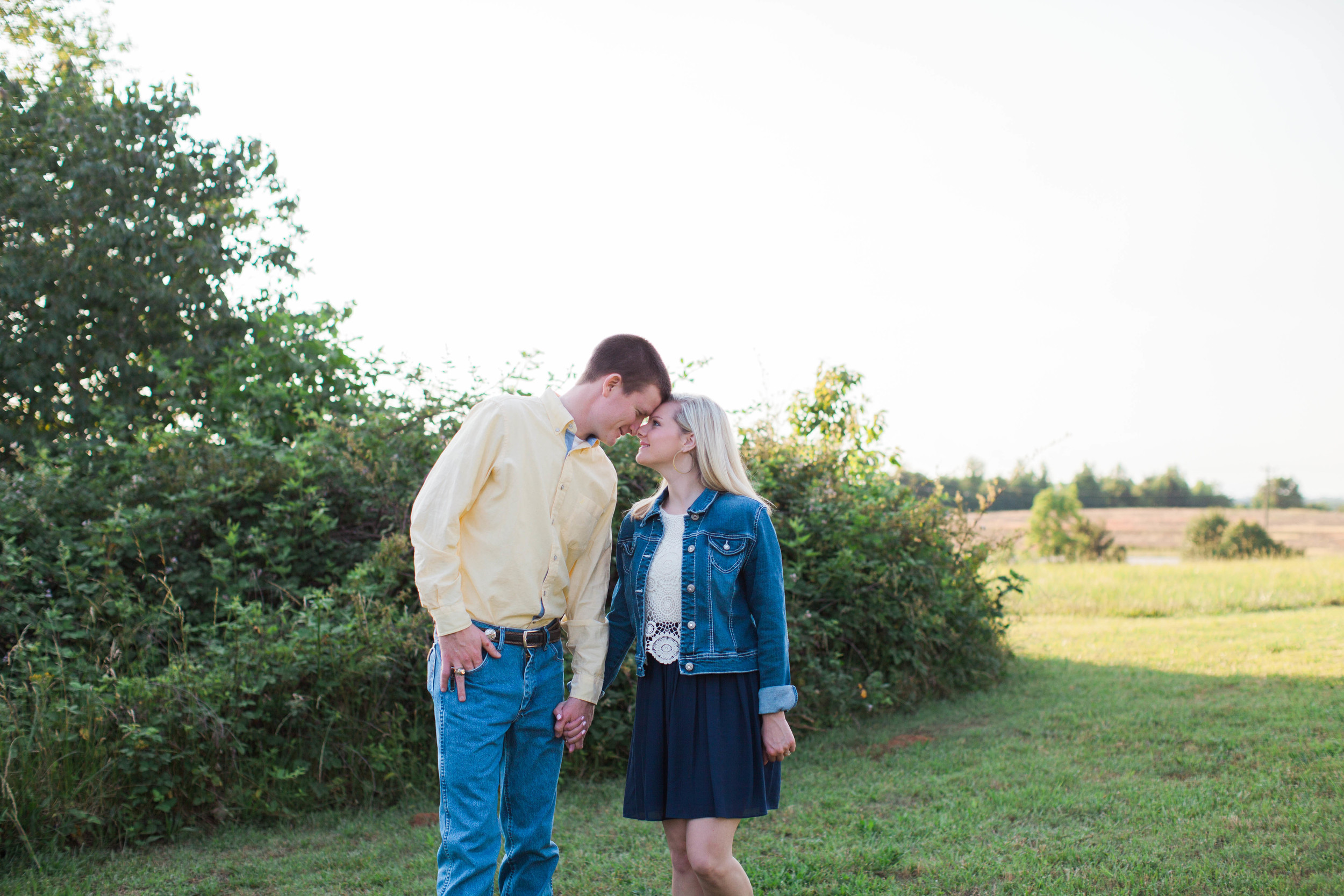 Couple in love at their engagement session at Ellery Farms