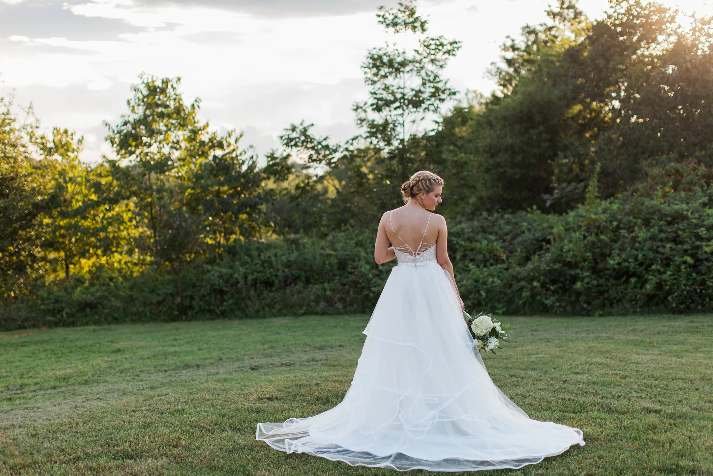 Beautiful bride in wedding dress at Ellery Farms