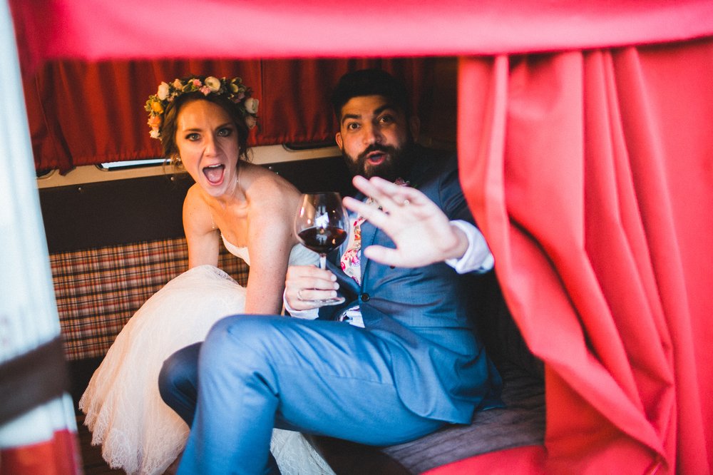 Lauren and Ali taking the photo booth for a spin after exchanging vows! Photo by Studio Castillero .