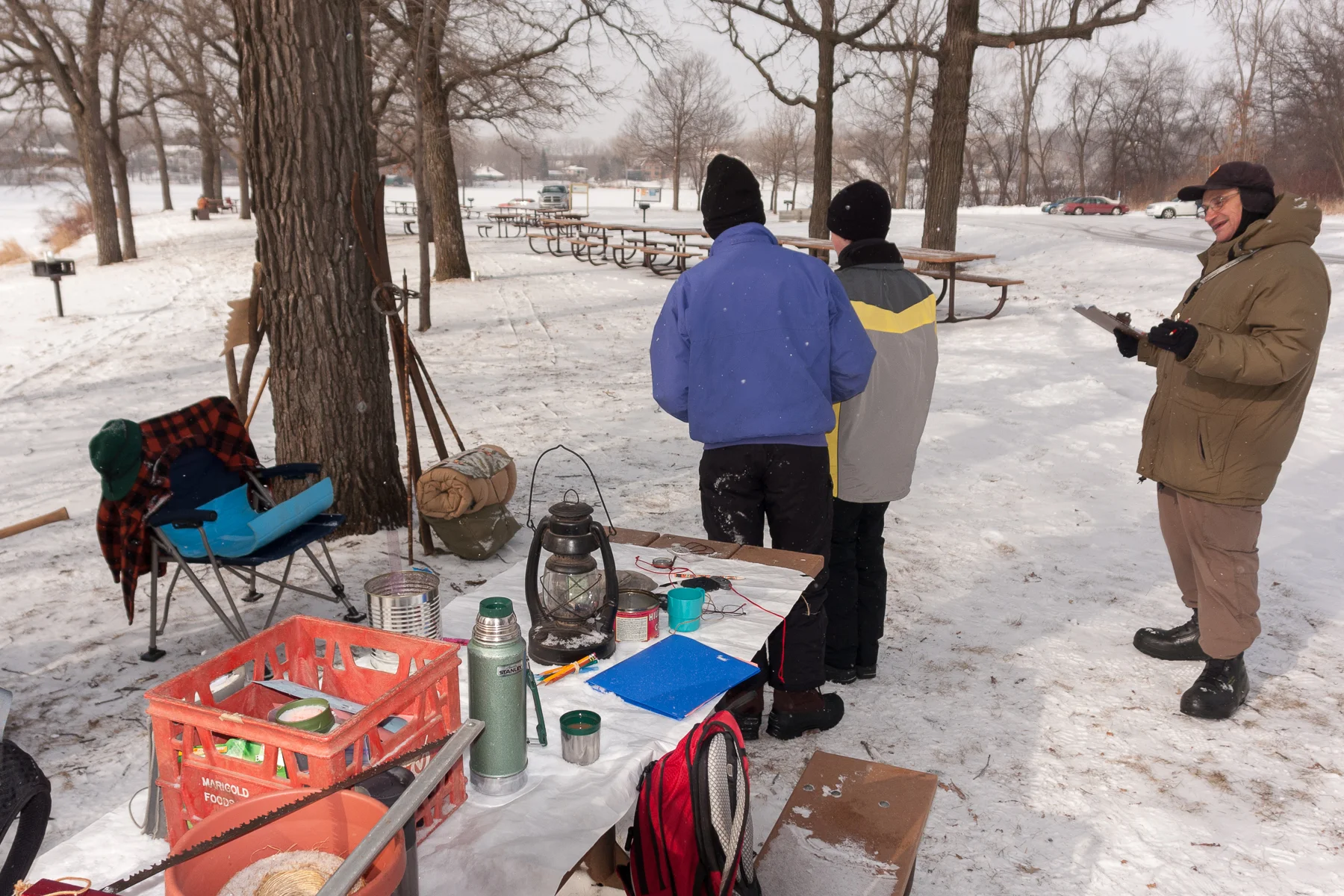 George P (mayor of the Chilkoot Territory) guides scouts in an orienteering exercise to stake a claim.