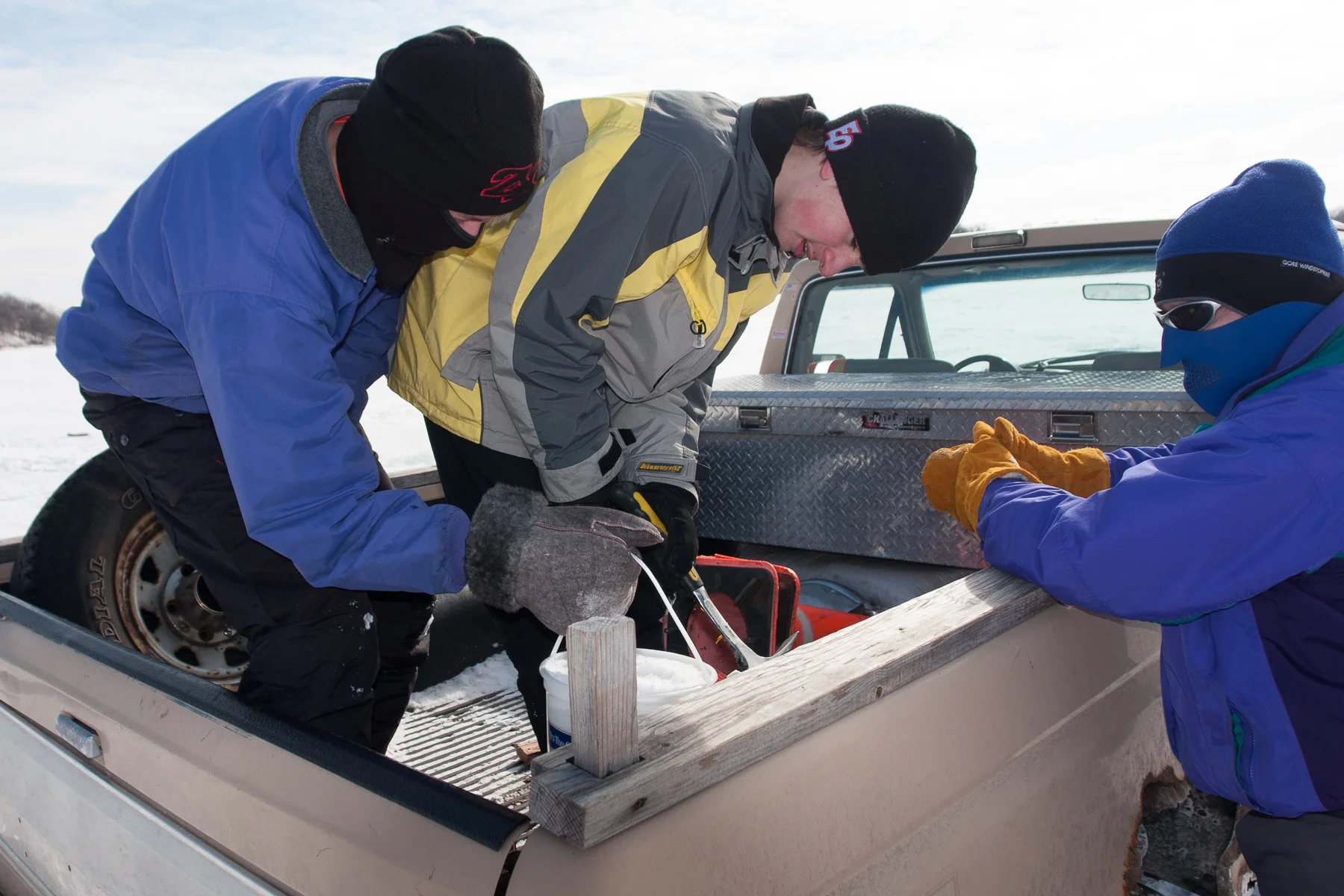 Successfully capturing the ice bucket, Erik J and Erik C break it open to get to the prizes frozen inside the bucket.