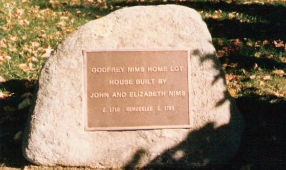 John Nims stone in front of the Nims House on the Main Street, a home now owned by Deerfield Academy.