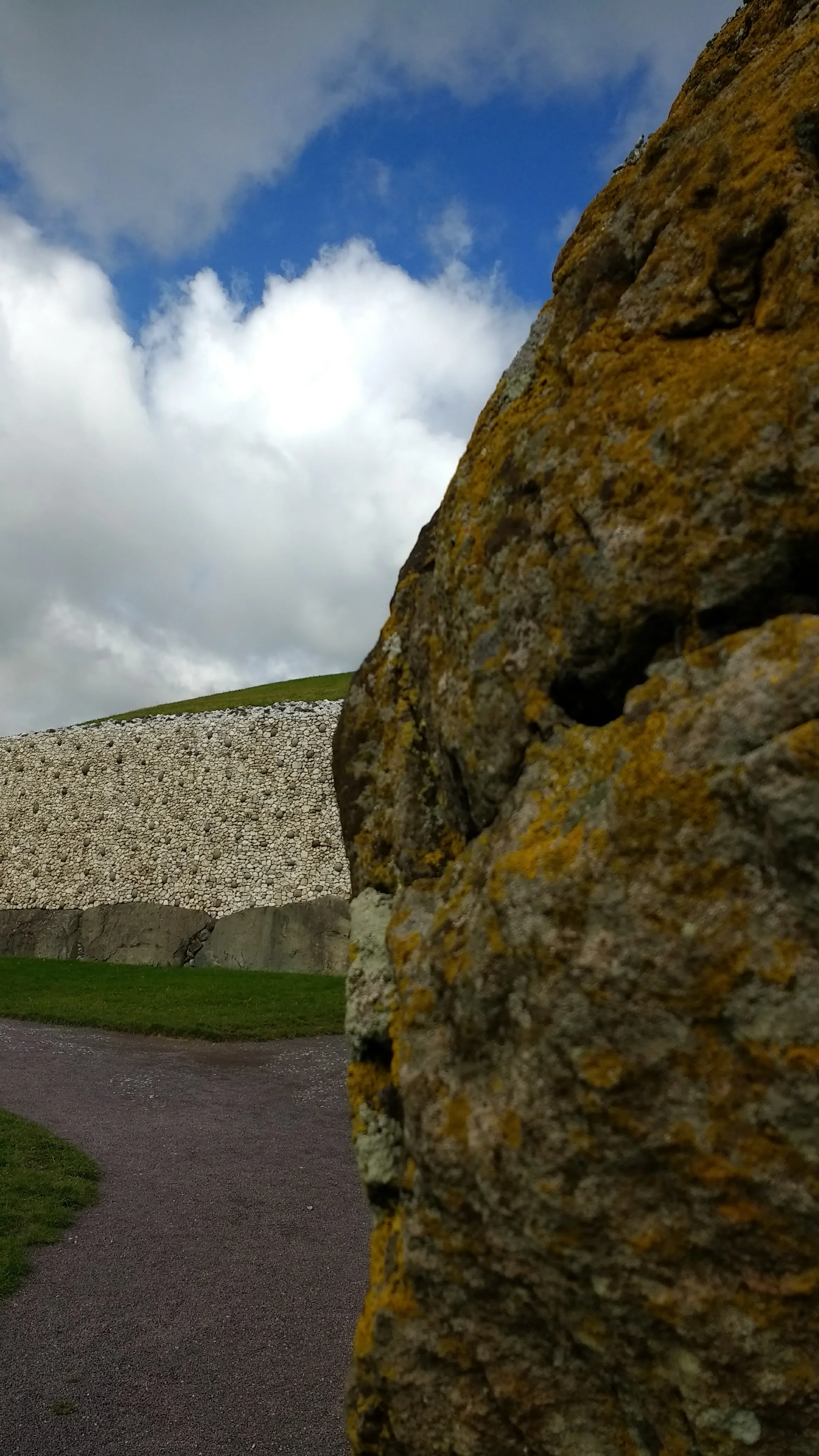 Foreground: standing stone; background: wall detail