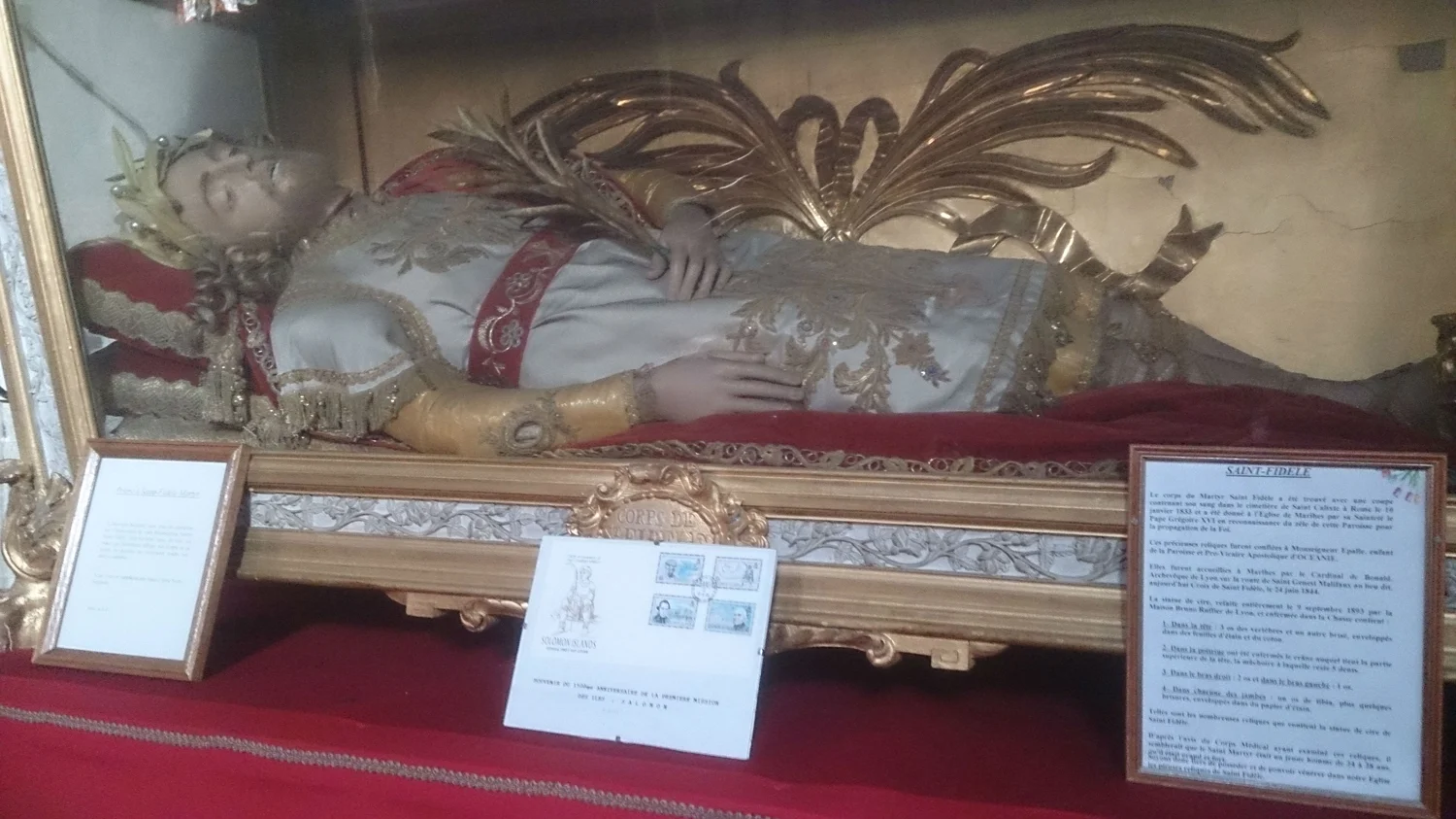 Common in European churches. They are not corpses, but usually contain relics of saints. (See exposed bone below elbow)