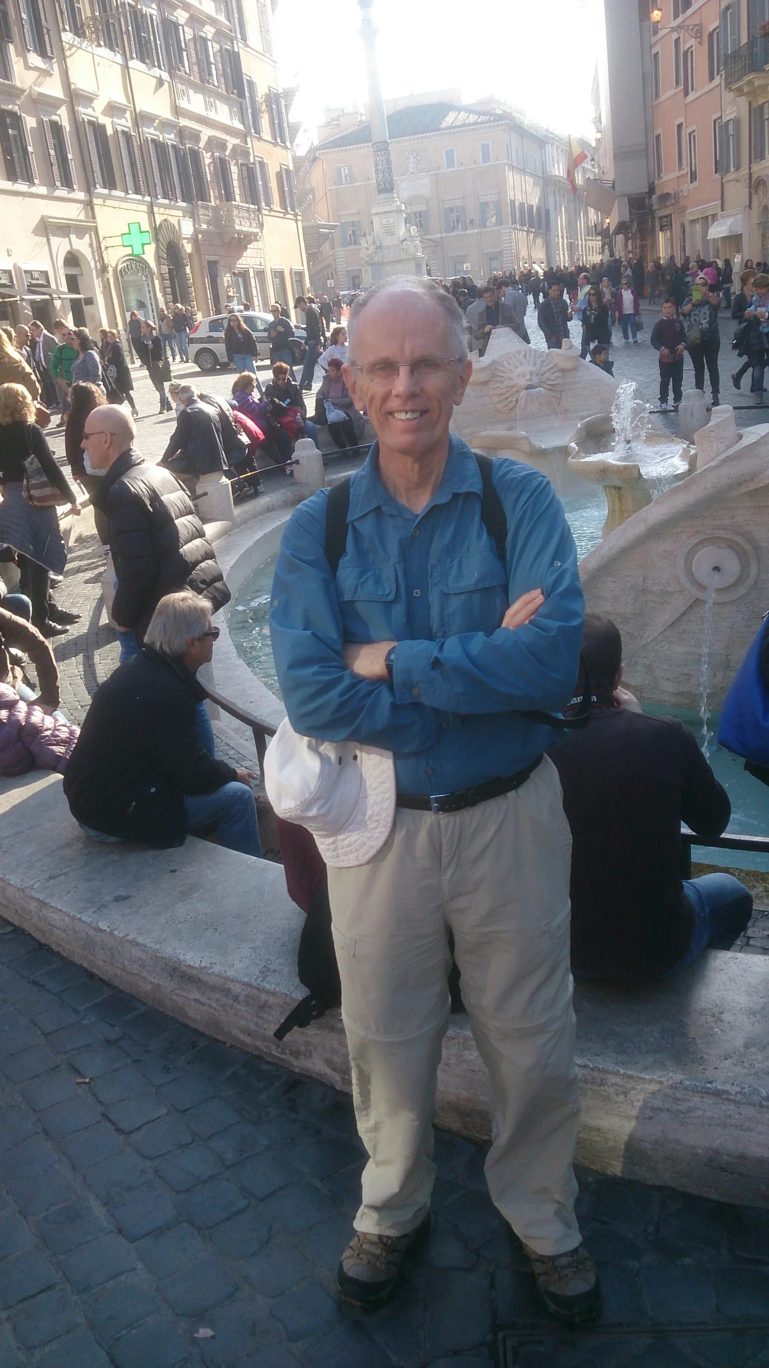 In front of the fountain at the foot of the Spanish Steps.