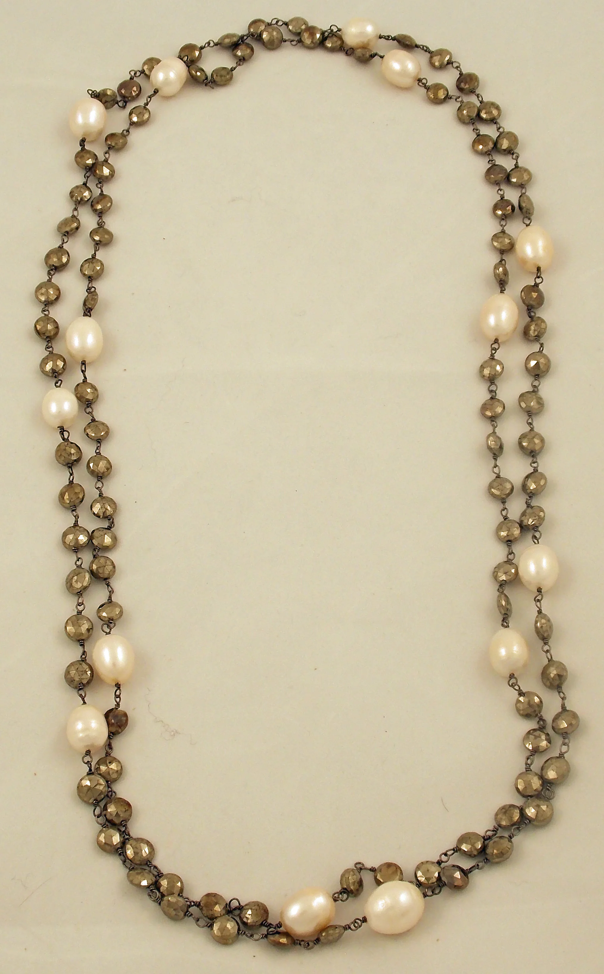 Pearl and pyrite strands