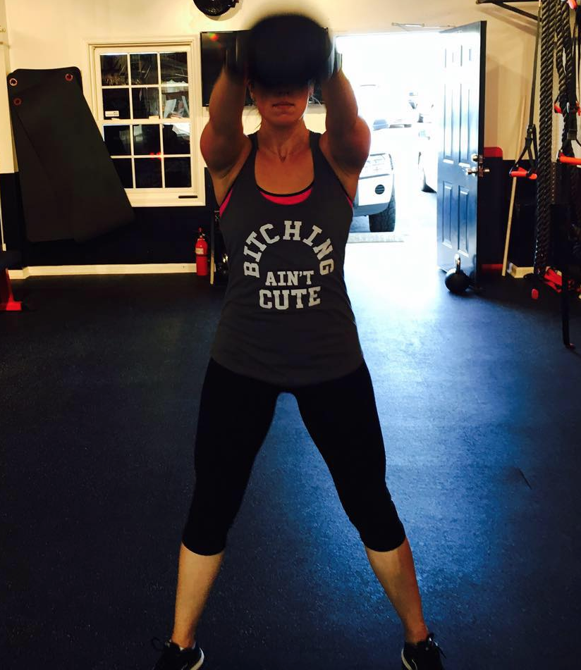 Doug's wife wearing QBC attire at the gym