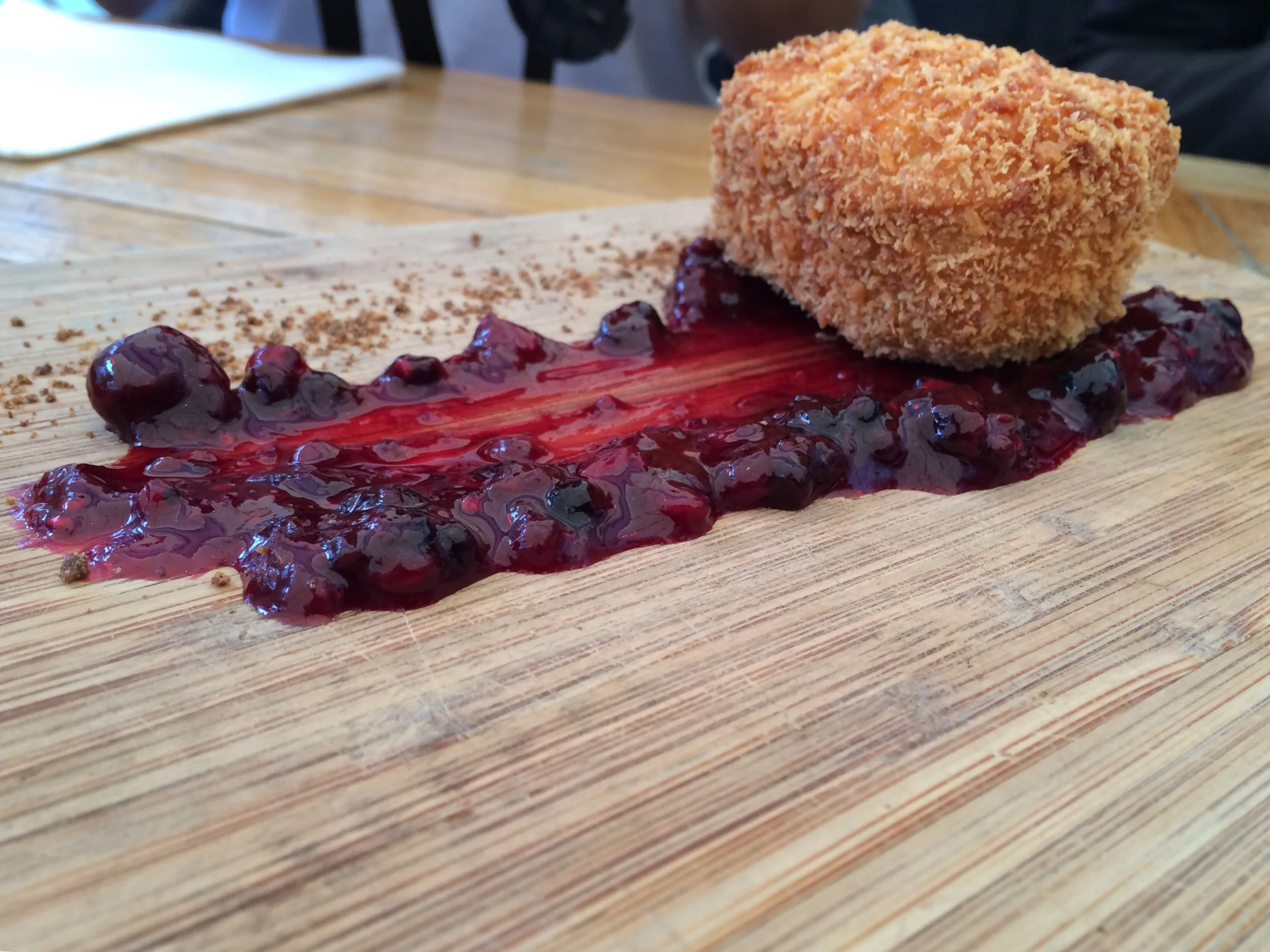 Artful board of fried cheese and cherry compote