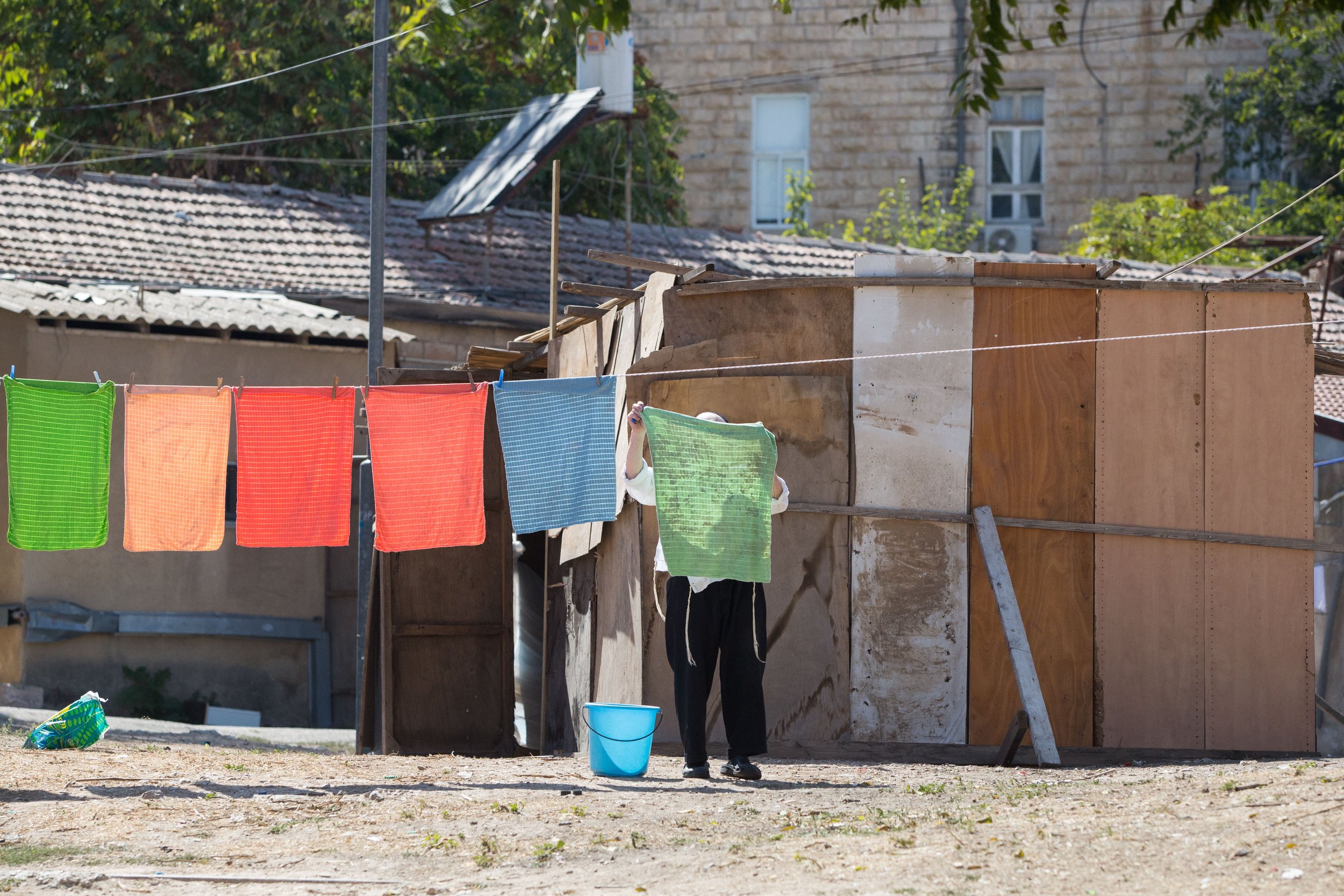  ultra-orthodox Jewish man hanging his laundry Friday afternoon before Shabbat, in Mea Shearim neighborhood in Jerusalem on September 21, 2018 