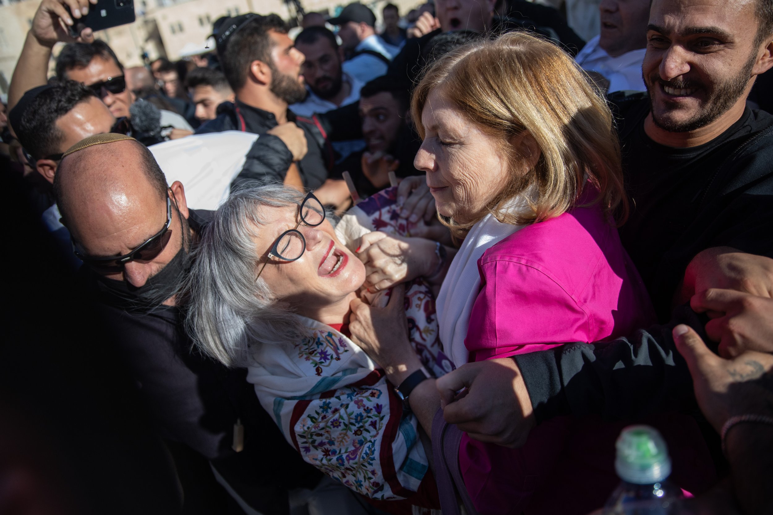  Women of the Wall leaders Anat Hoffman and Lesley Sachs led out of the Western Wall by security guards after bringing in to prayers a Torah scroll, during Rosh Hodesh prayers at the Western Wall in Jerusalem Old City, November 5, 2021.   