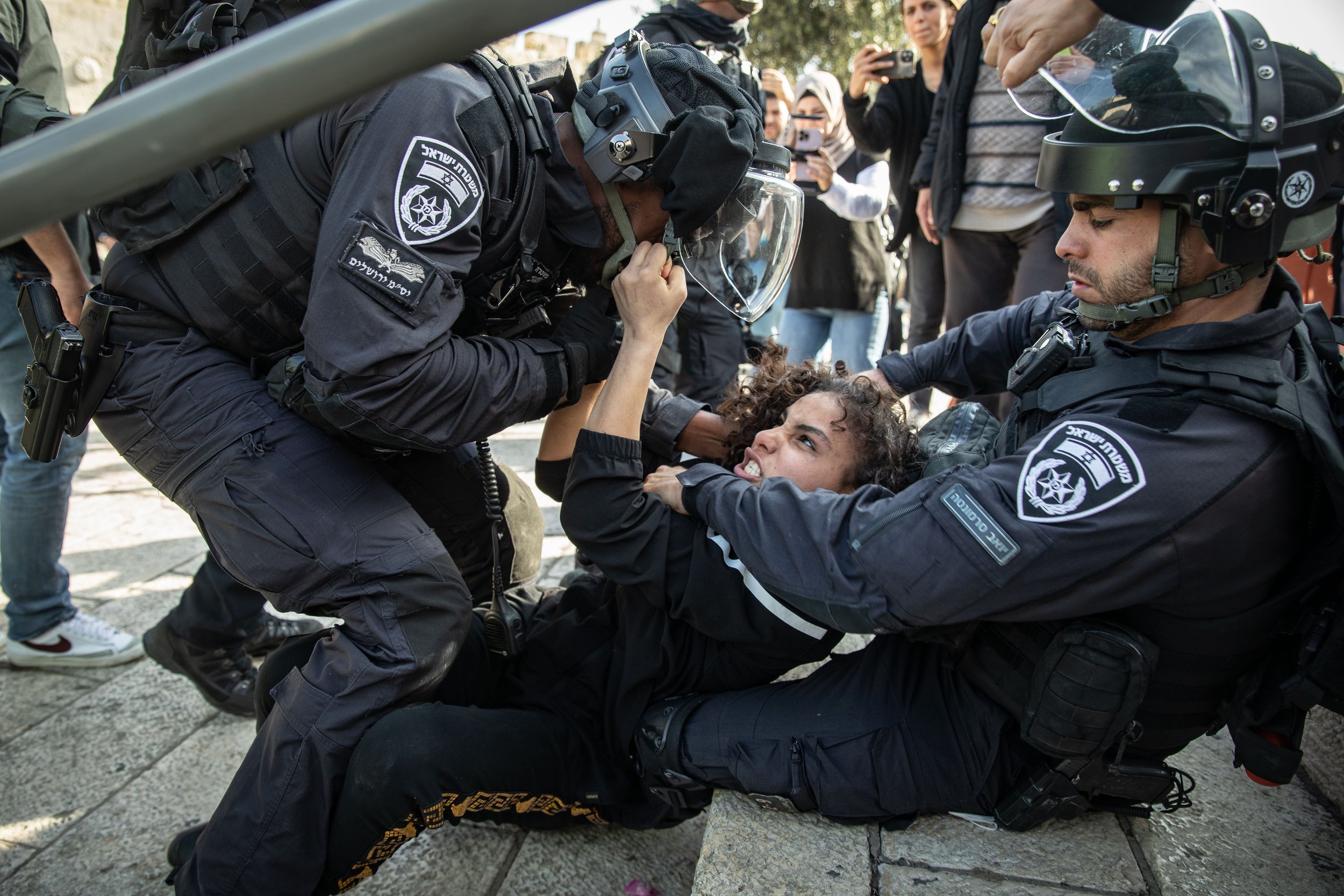  Israeli police forces arrest a Palestinian girl during clashes at the Damascus gate in Jerusalem. While thousands of Muslims on the way for prayers of 'Isra Wal Miraj' on February 28, 2022. 