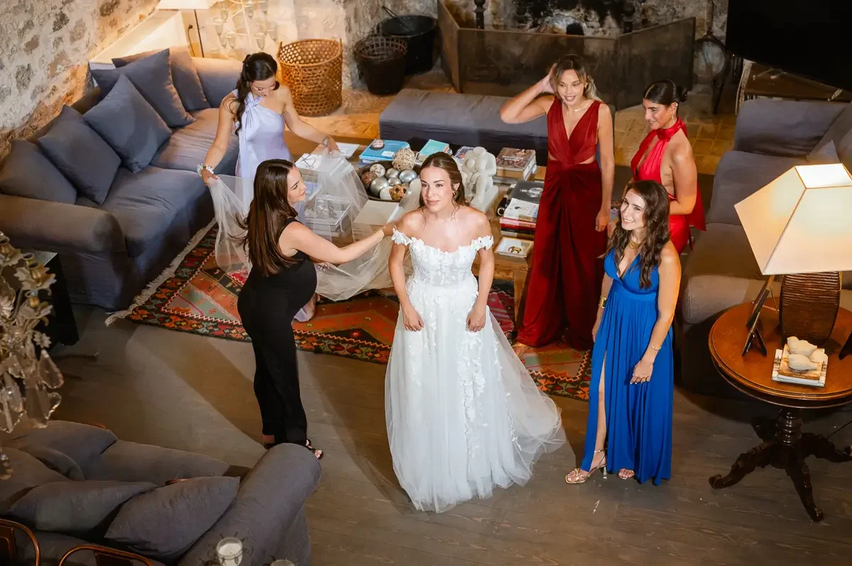 bride and bridesmaids in romantic gown at sinterina