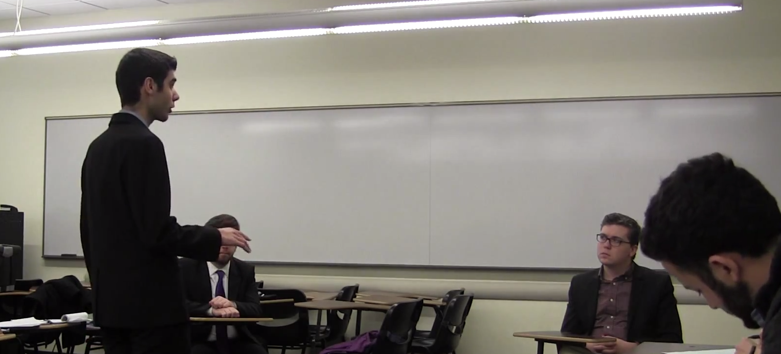 Oliver Zoellner (right) handles a cross examination by Loyola Chicago