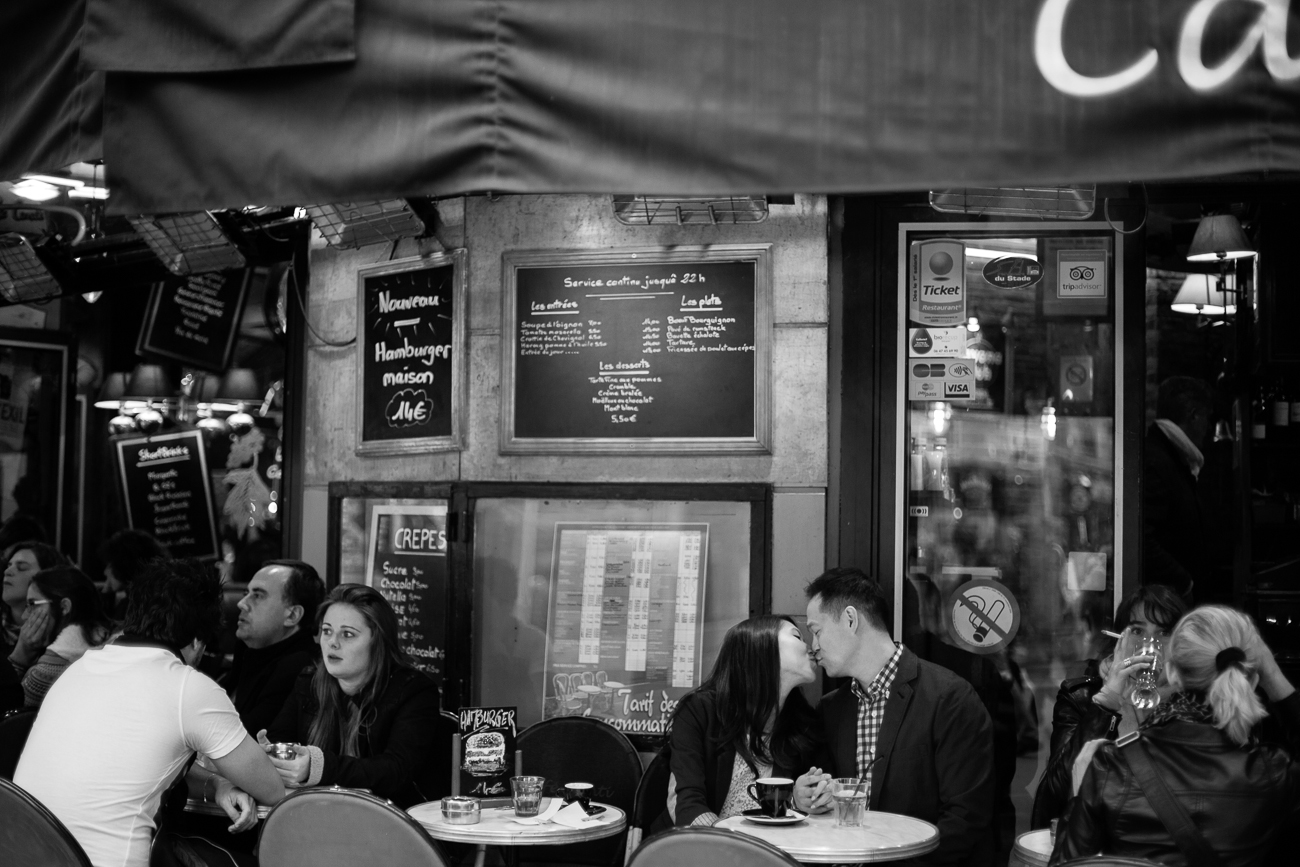 couple in paris cafe kissing.jpg