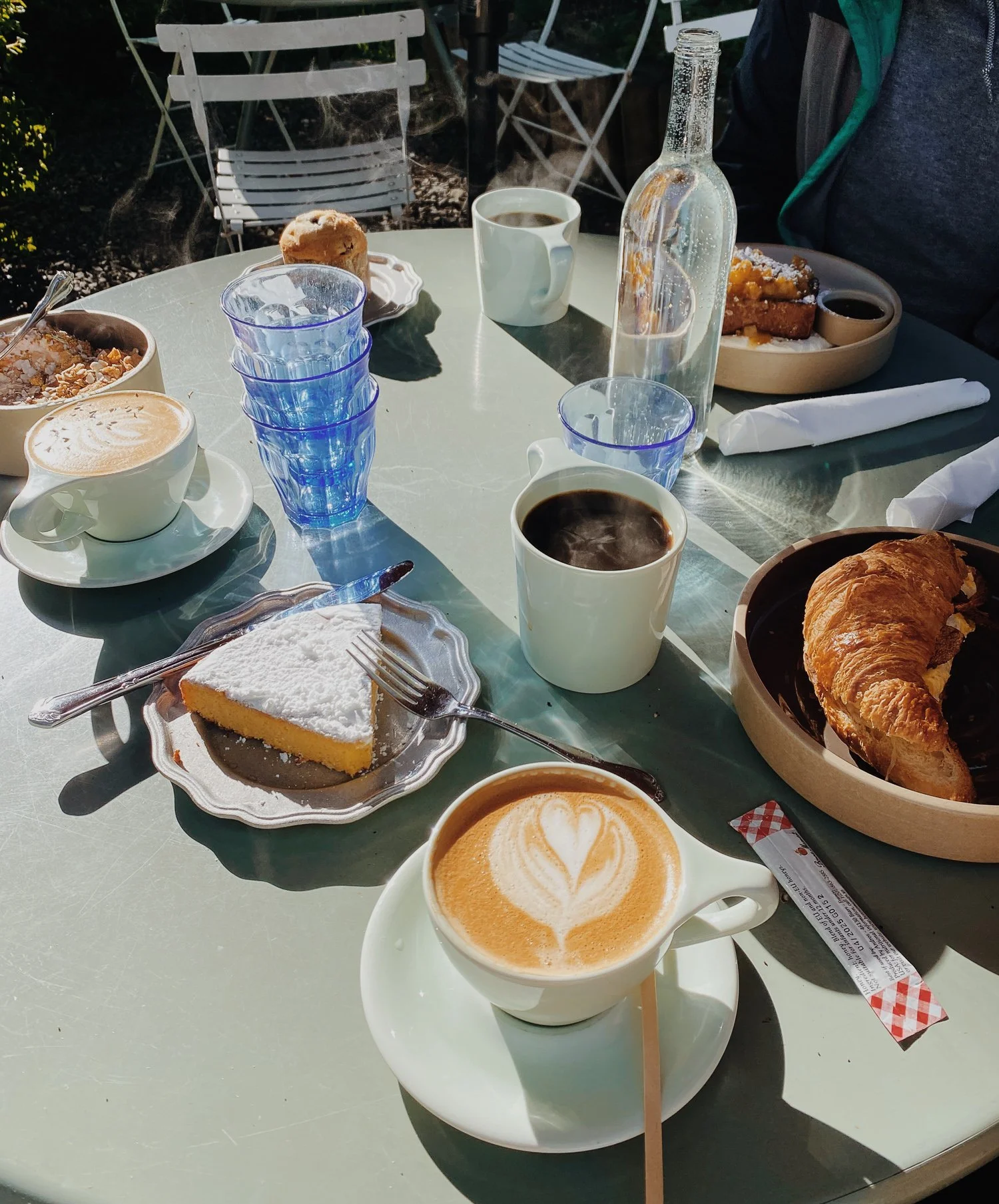 Coffee, pastries, and breakfast at an outdoor table at Persephone Bakery in Jackson Hole