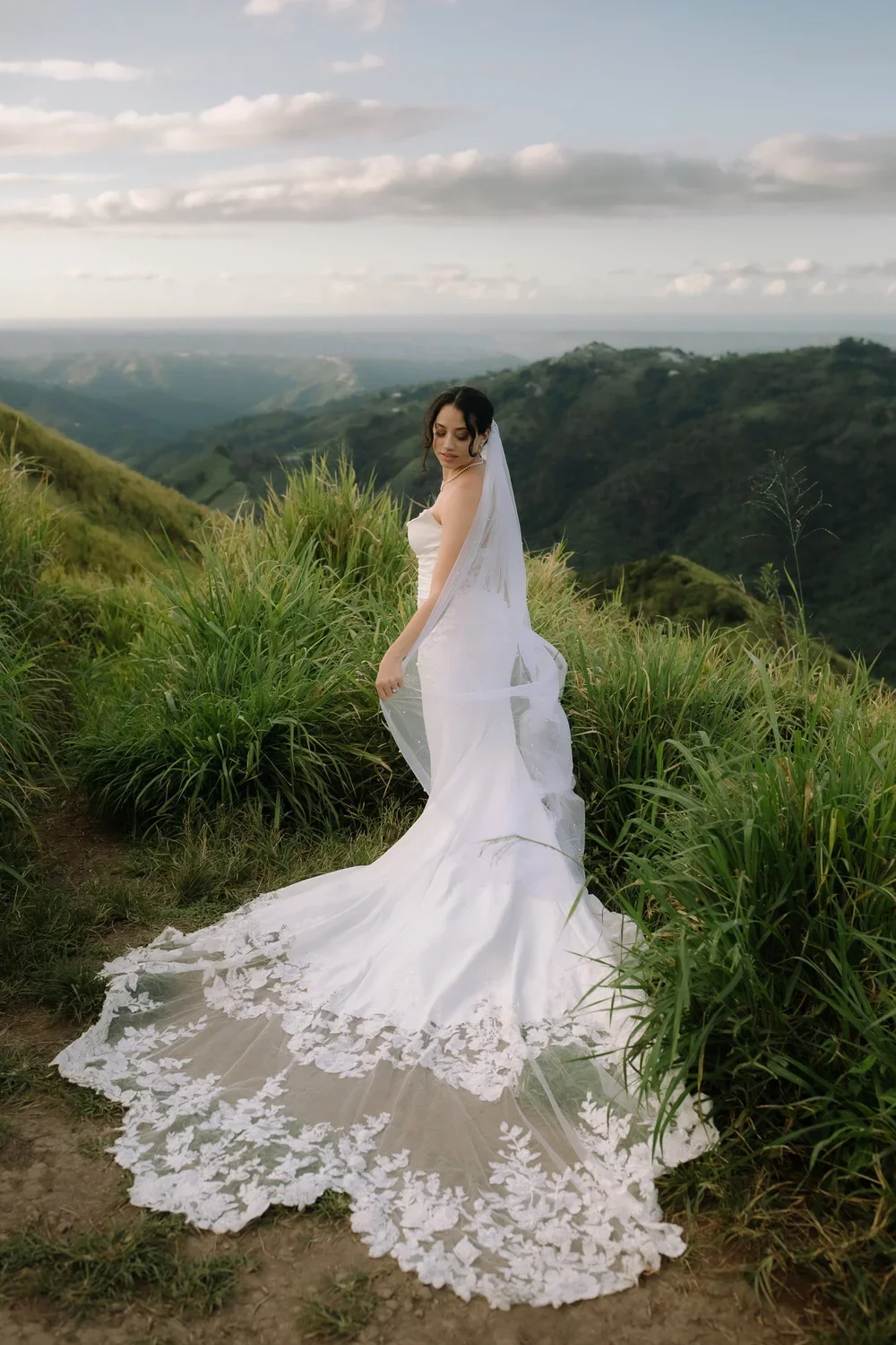 Bride standing on a mountain trail during a Cerro Mime elopement in Puerto Rico