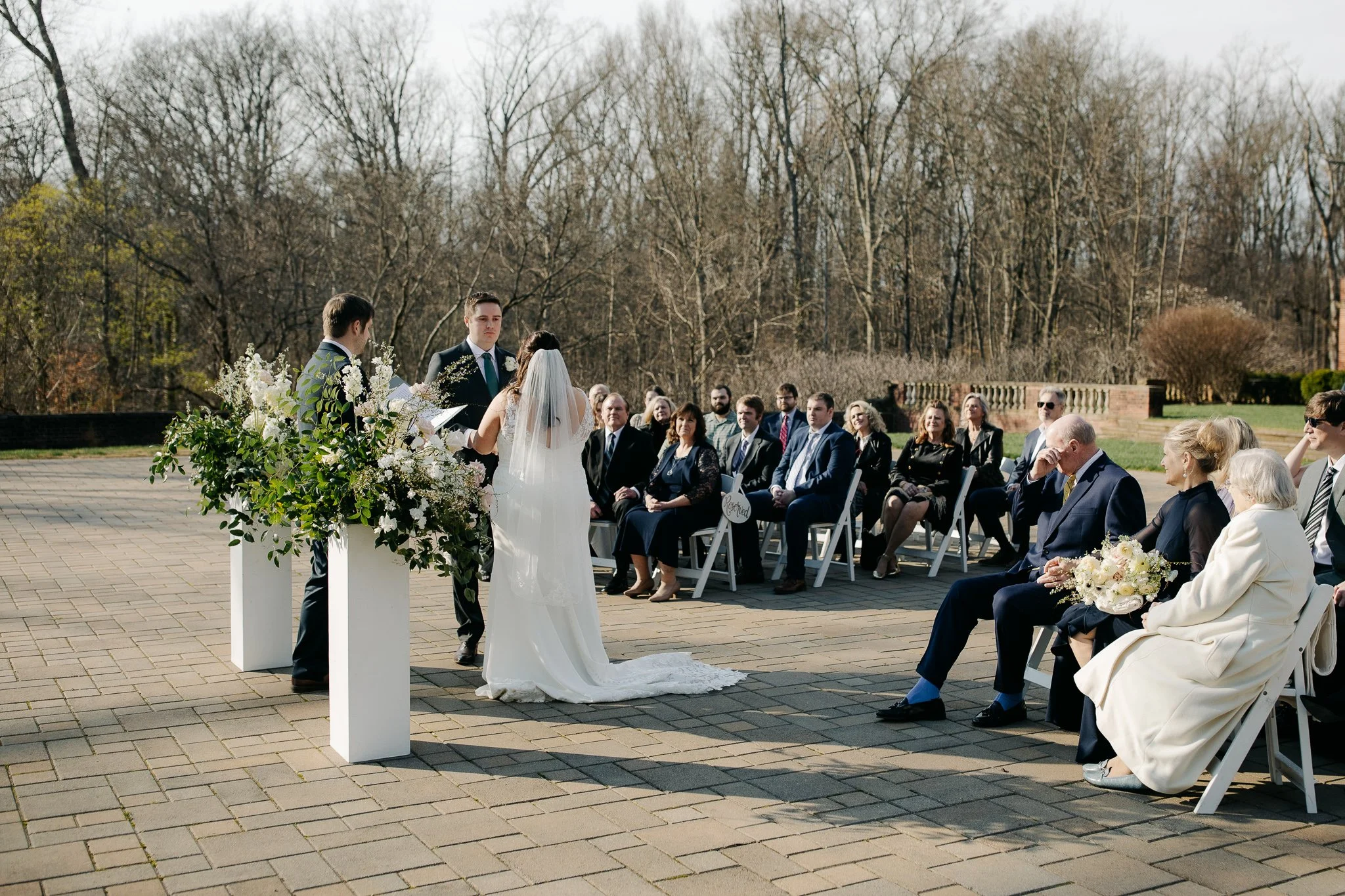 Bride and groom exchanging vows during terrace ceremony