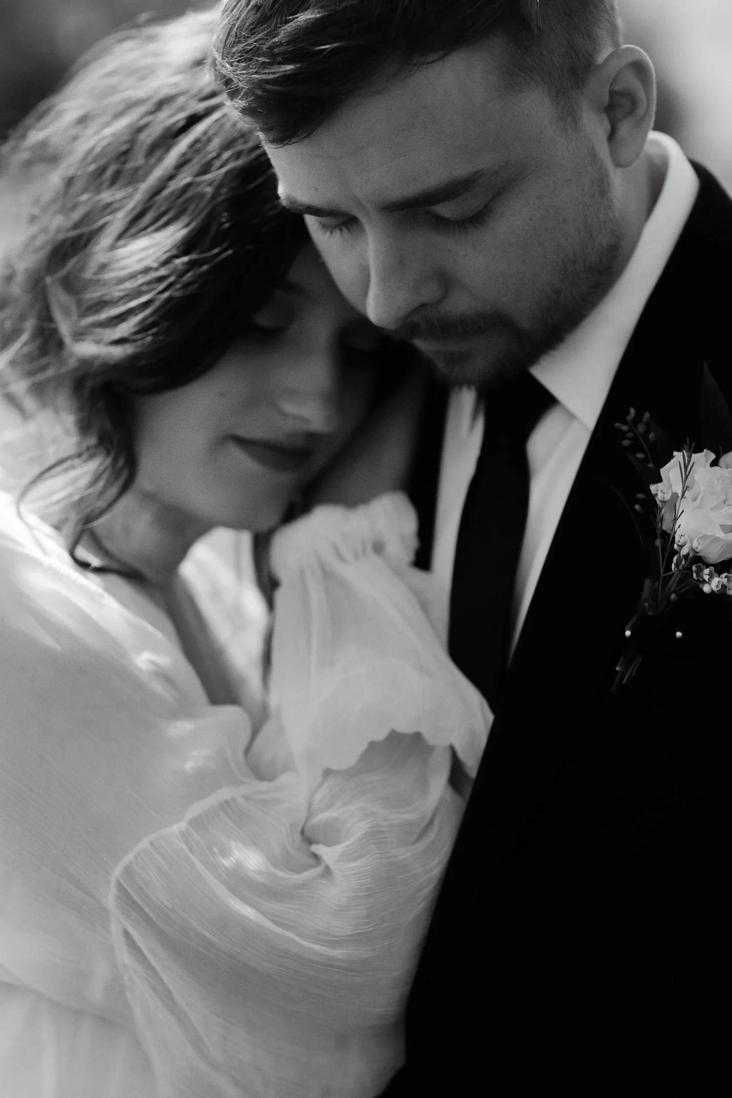 Black and white portrait of a couple embracing on their wedding day in Dayton, Ohio