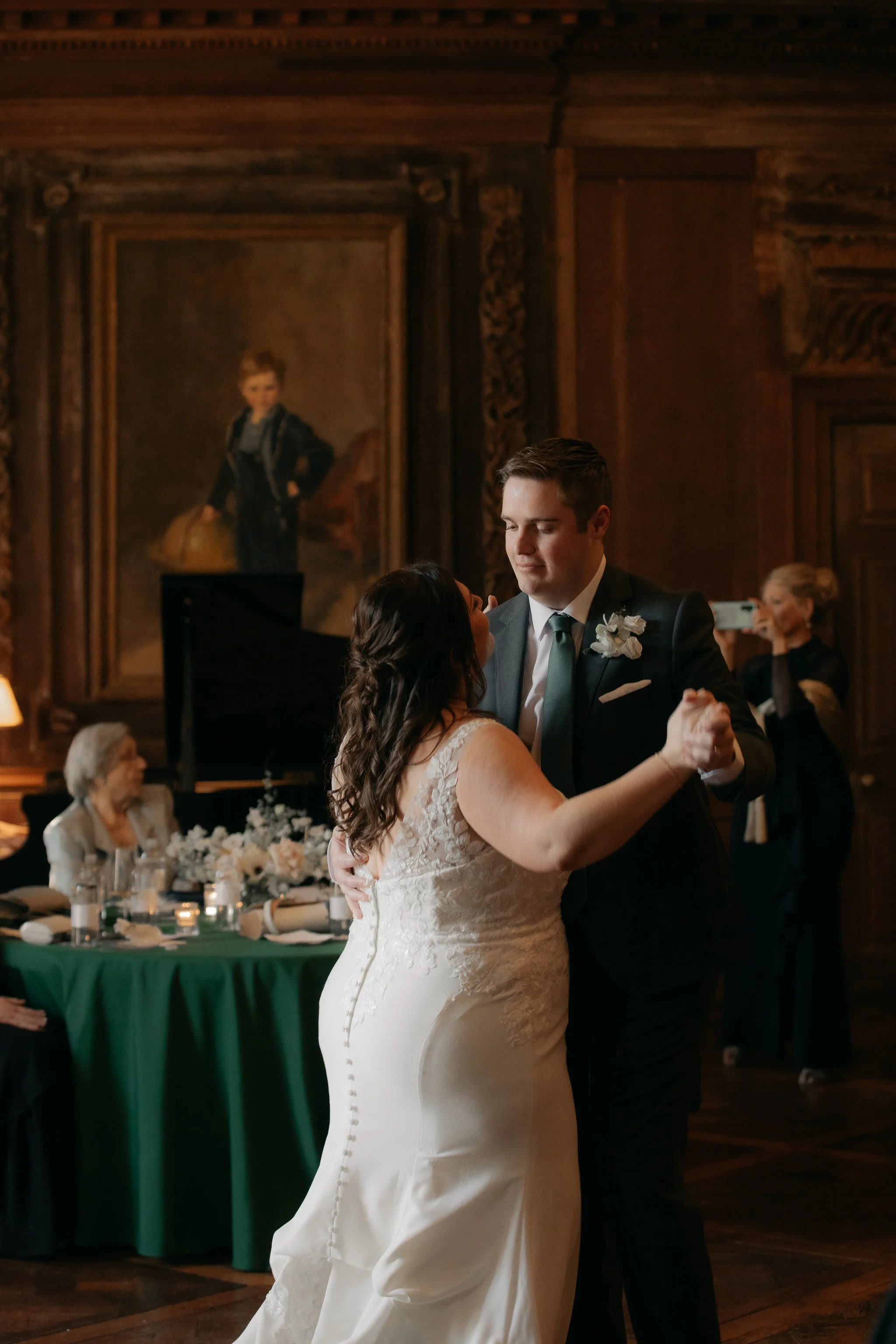 Bride and groom sharing first dance inside grand room at Peterloon Estate