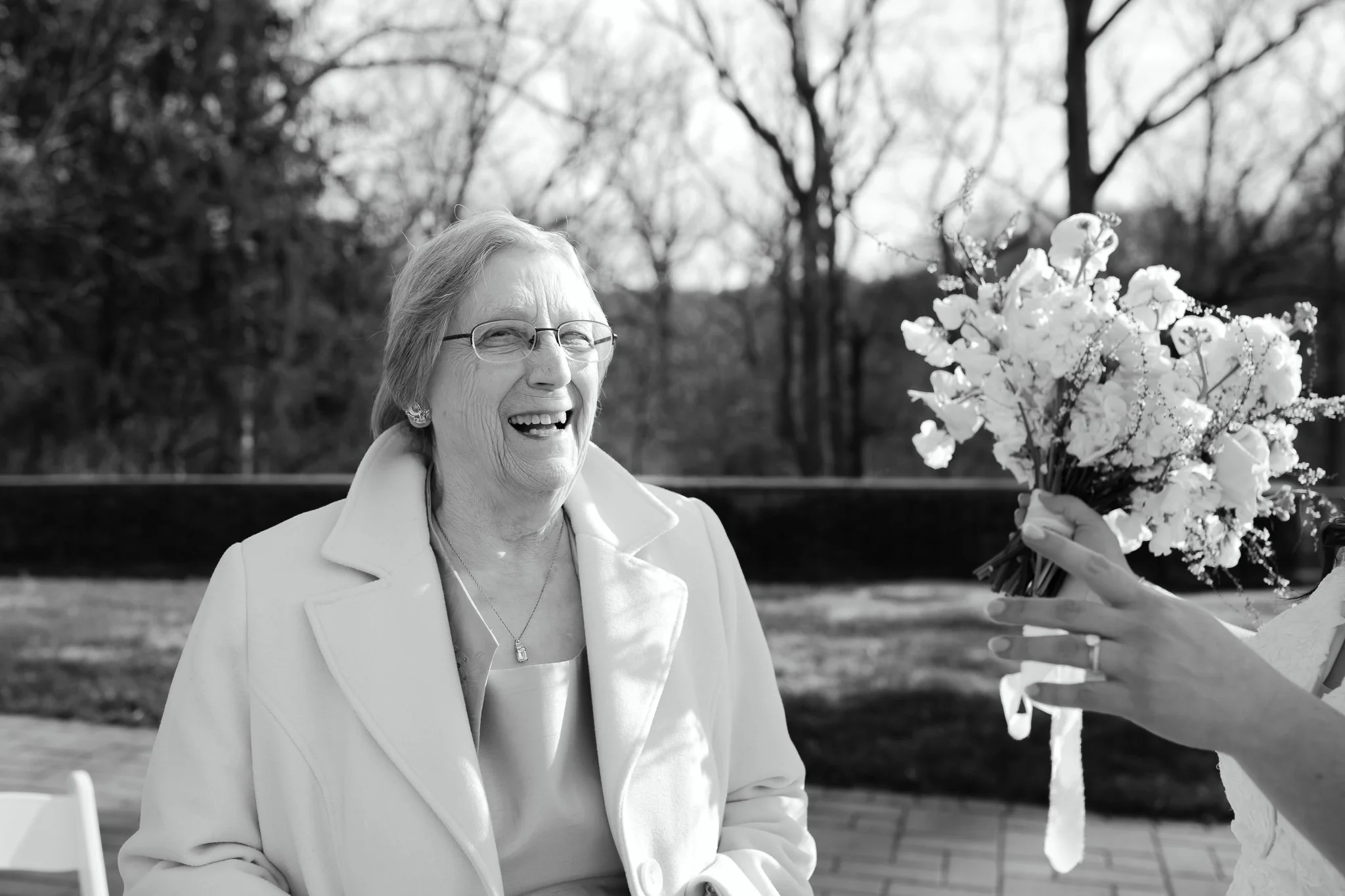 Grandmother smiling during wedding ceremony moment