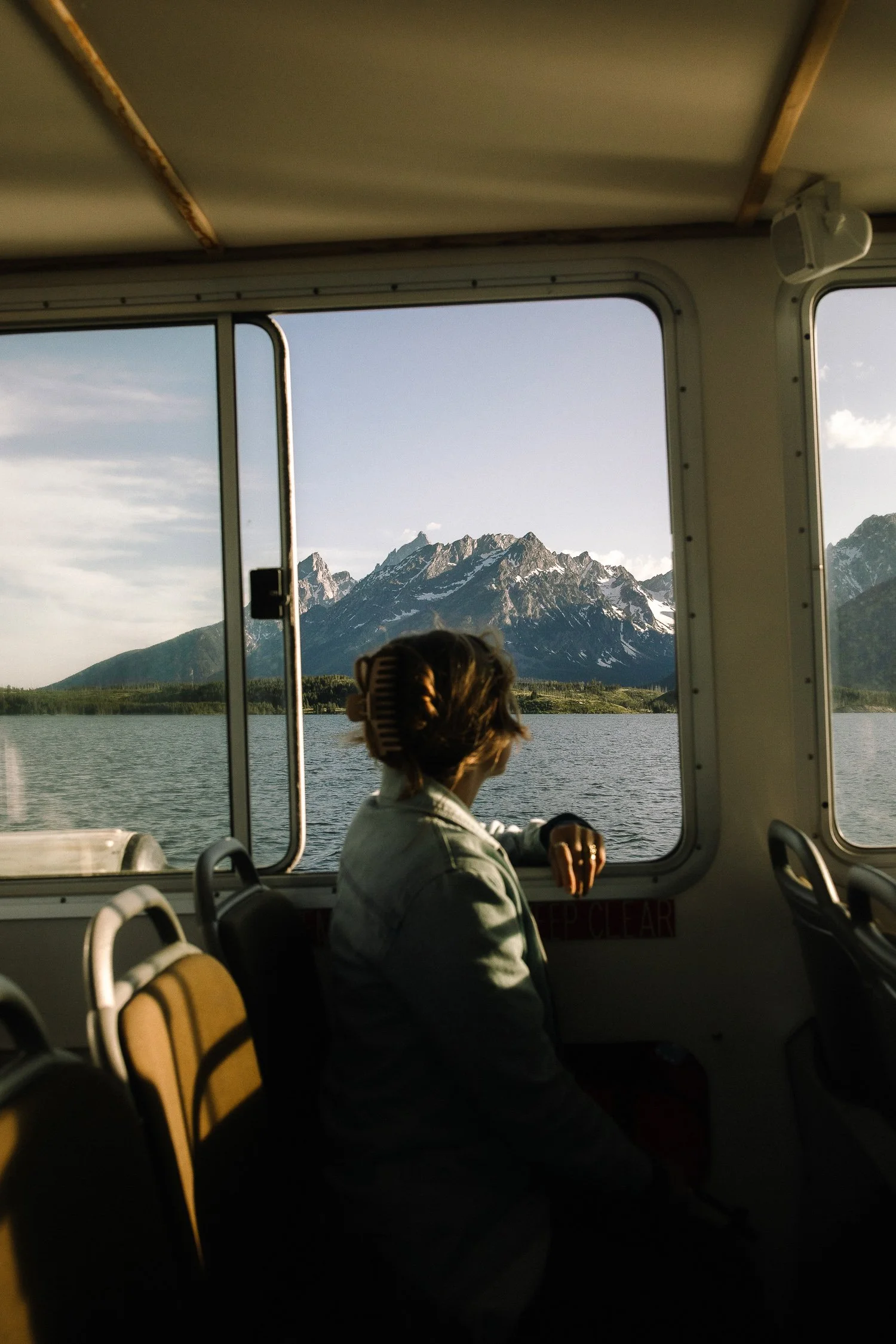 View of the Teton Range from inside a boat on Jackson Lake in Grand Teton National Park