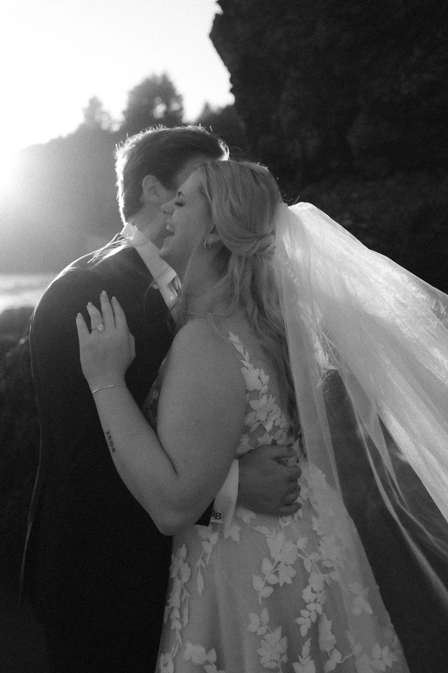 Black and white portrait of couple embracing during a Jedediah Smith Redwoods elopement
