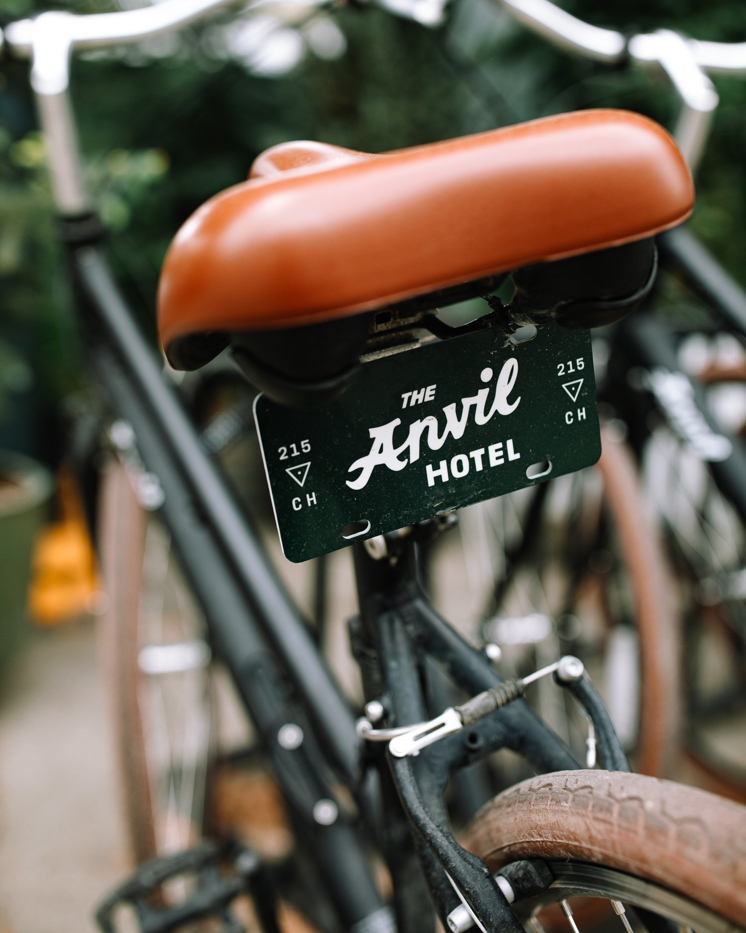 Bicycle with Anvil Hotel branding parked outside the hotel in Jackson Hole
