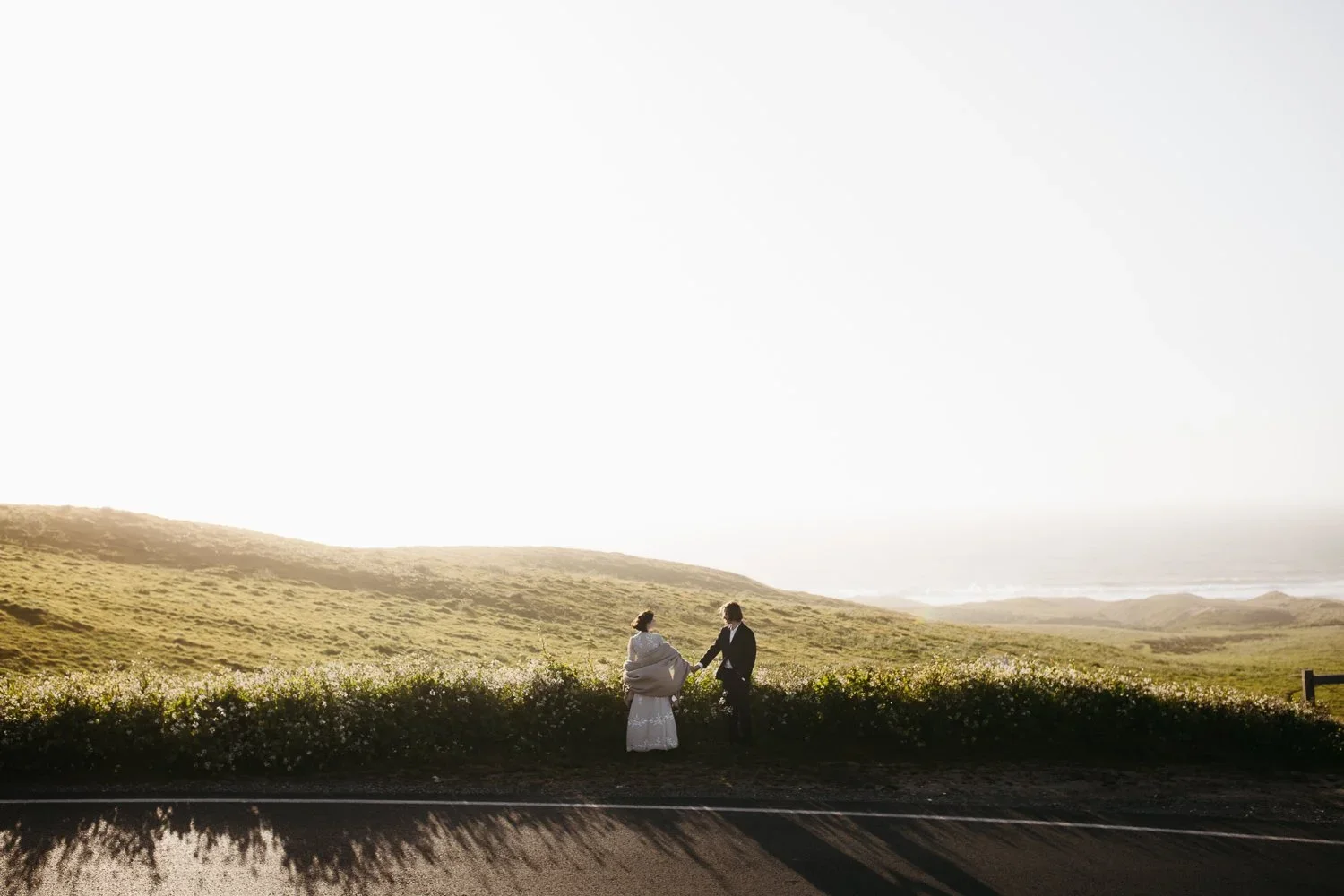 Small elopement ceremony overlooking the cliffs at Point Reyes National Seashore